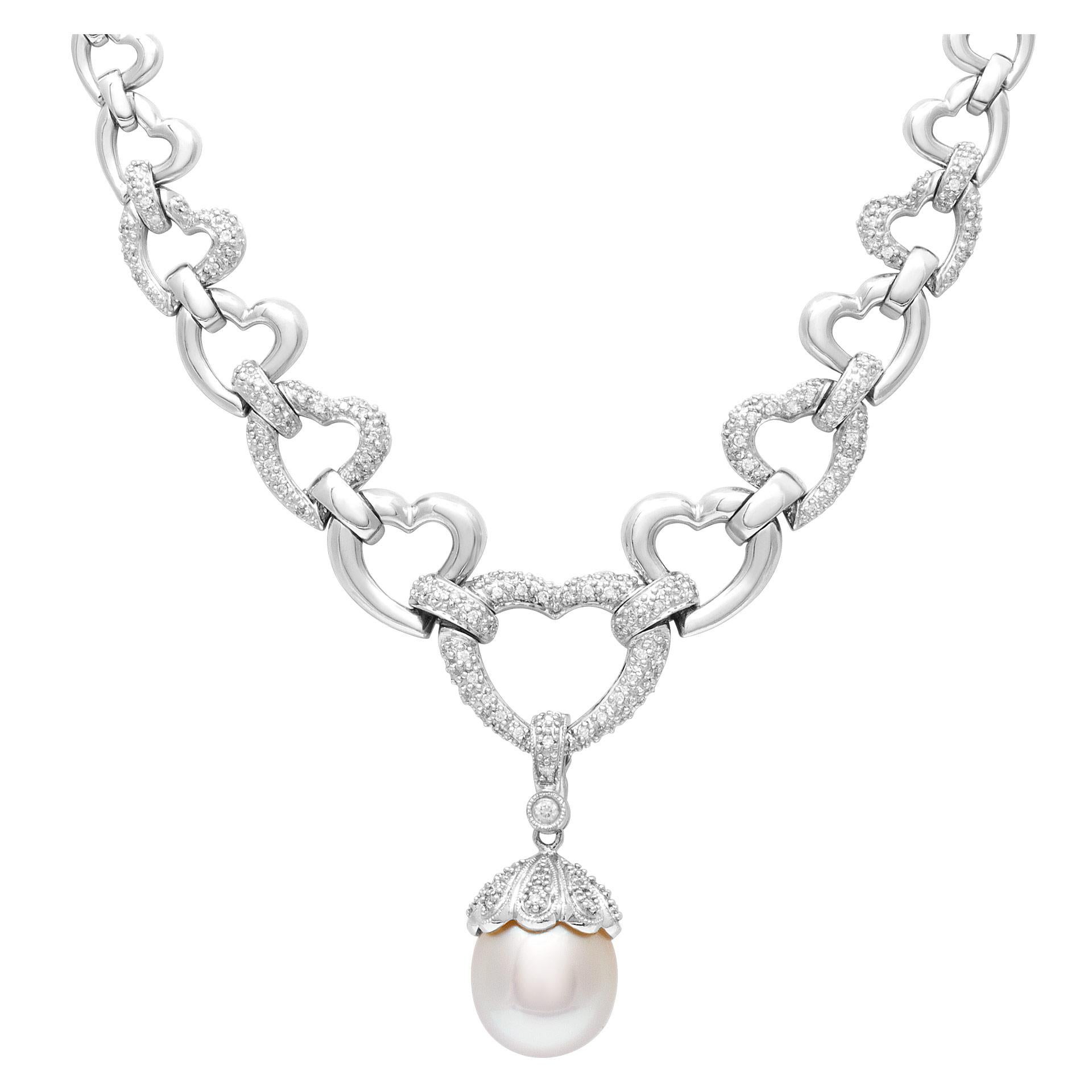 ESTIMATED RETAIL: $8,390 YOUR PRICE: $5,220 - Elegant heart link necklace in 14k white gold with 12mm South Sea cultured pearl with silver overtone accented with over 1 carat in diamond accents. 18