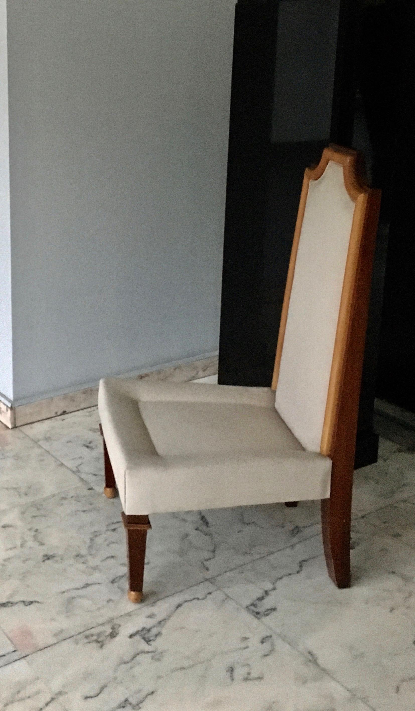 Fine low chair from the end of the forties with the original beige covering.
Two-tones wood base.
By J.M. Rothschild, France, 1948.