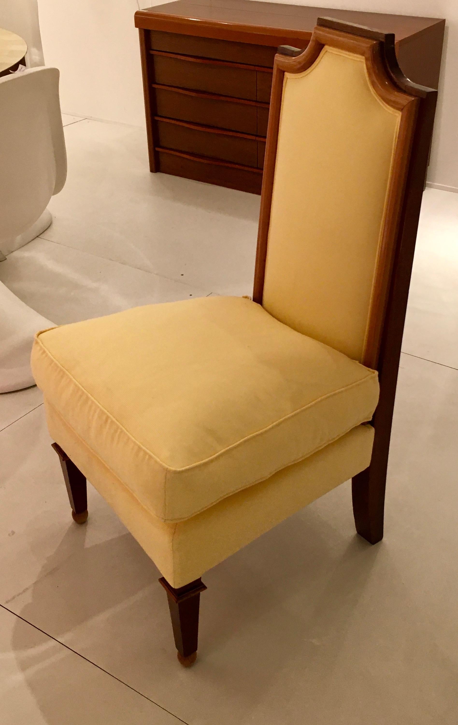 Fine low chair from the end of the forties with new yellow fabric covering.
Two-tones wood frame.
By J.M. Rothschild, France, 1948.