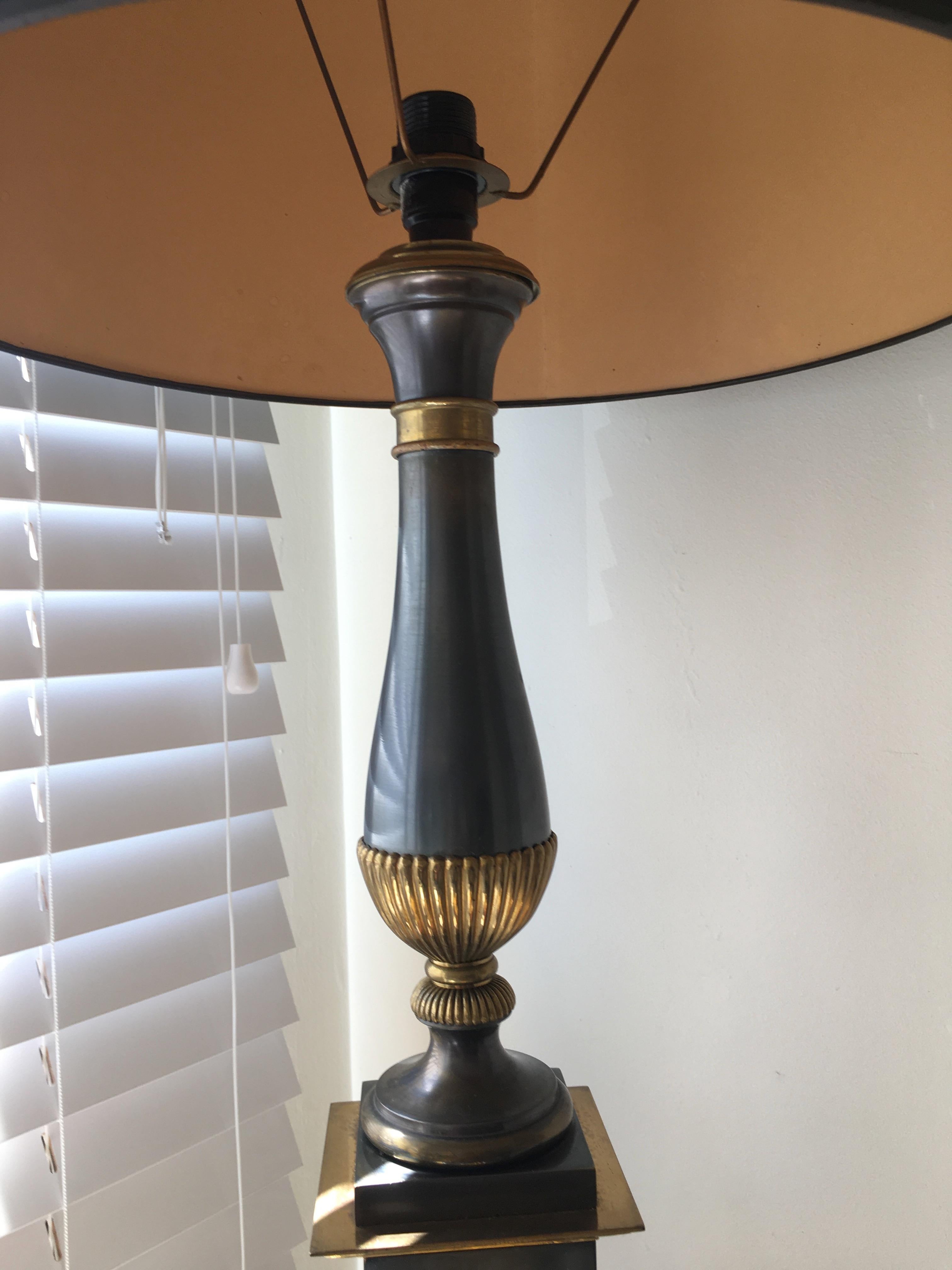 Brass, bronze and gun metal finish table lamp.
One light.
Attributed to Maison Charles, France 1960.
  