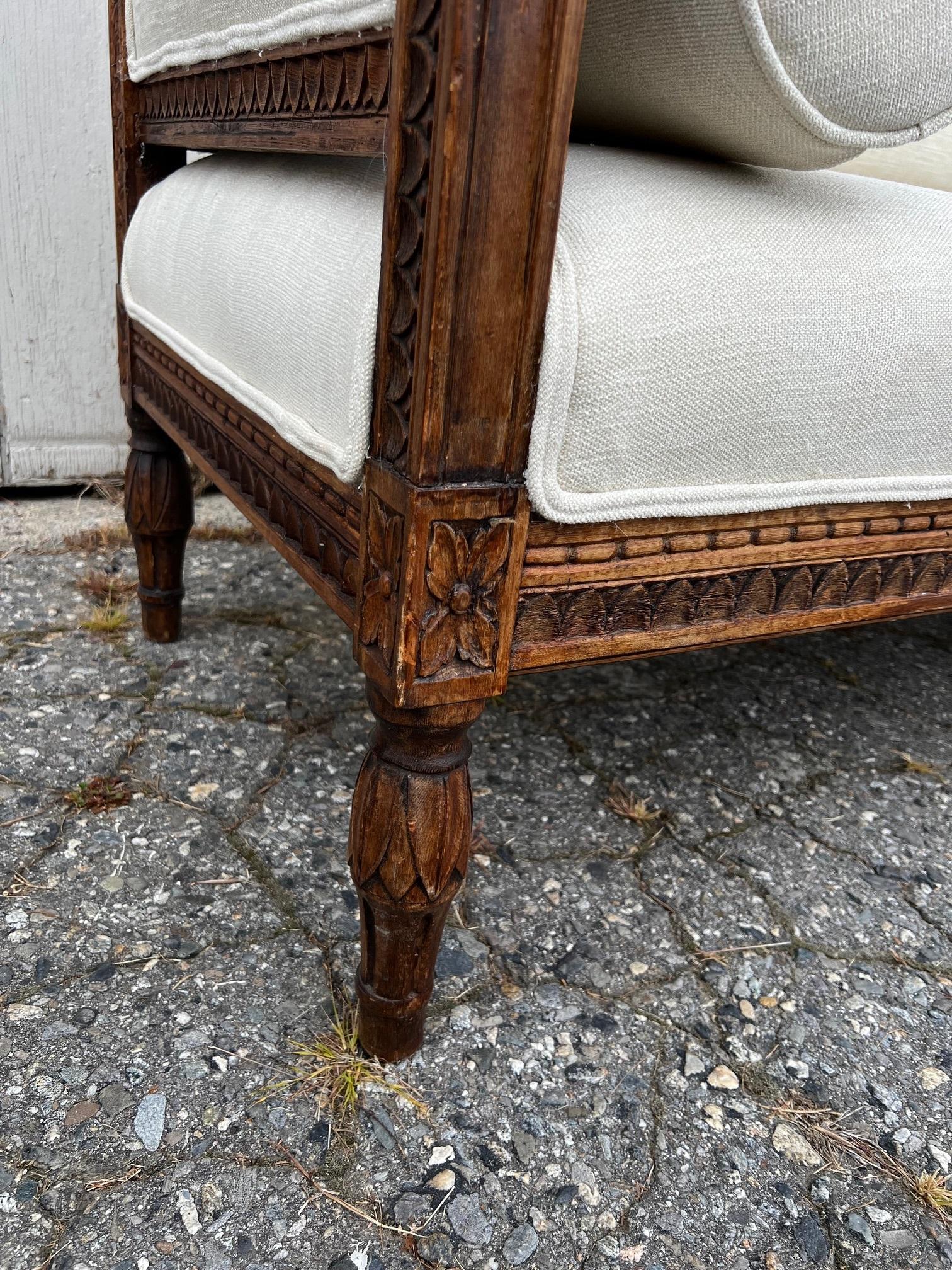  
Spectacular newly upholstered early 19th century Swedish Gustavian sofa or settee, having its original wood color (never painted; very rare!) and in amazing condition. Ca 1810 Sweden. Has been professionally upholstered in a woven, white new high