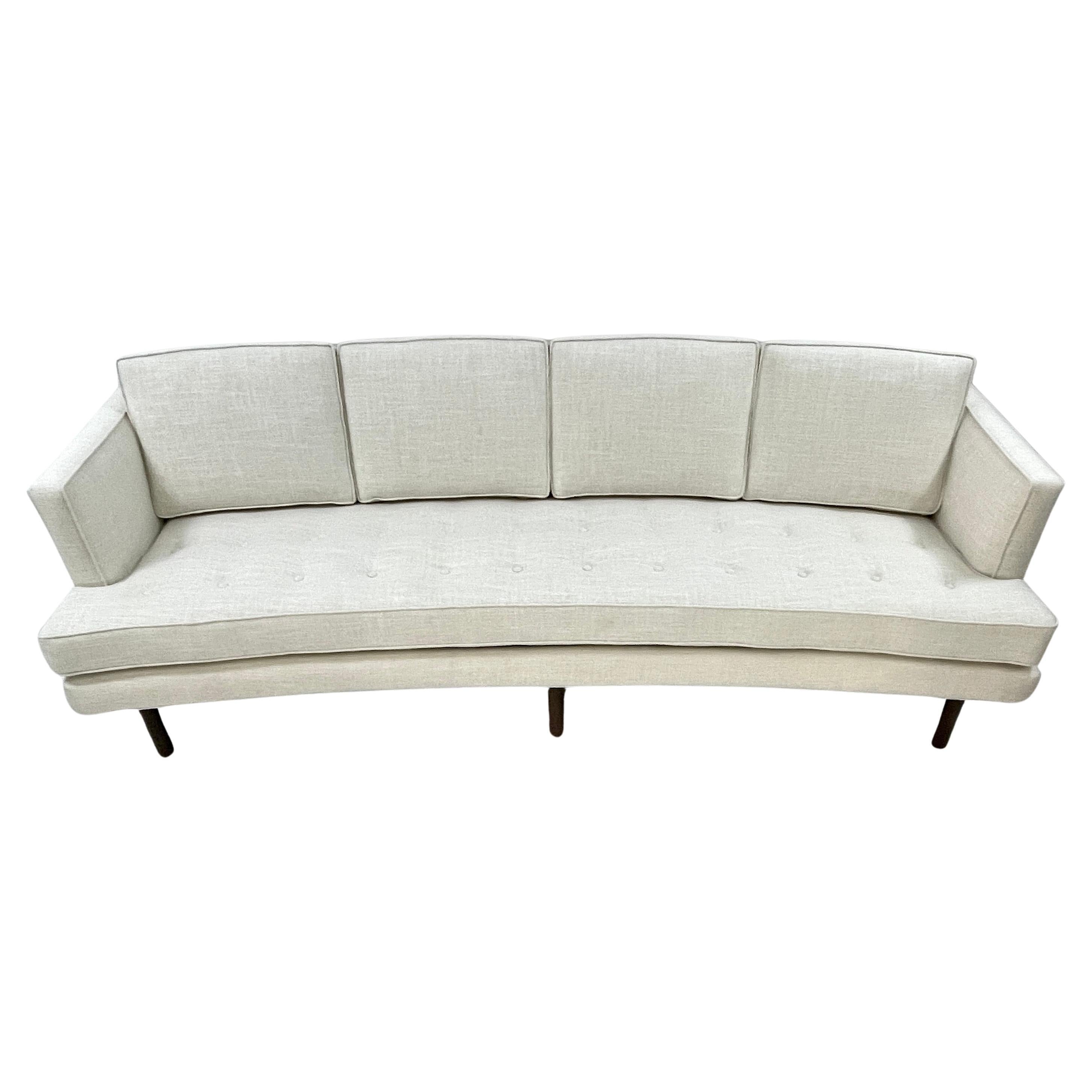 Stunning freshly upholstery Harvey Probber sofa. The upholstery is a modern and sensible cotton blend weave which will wear and clean very well. The overall color reads as a creamy white. The weave closeup is white and tan.
All new cushions make