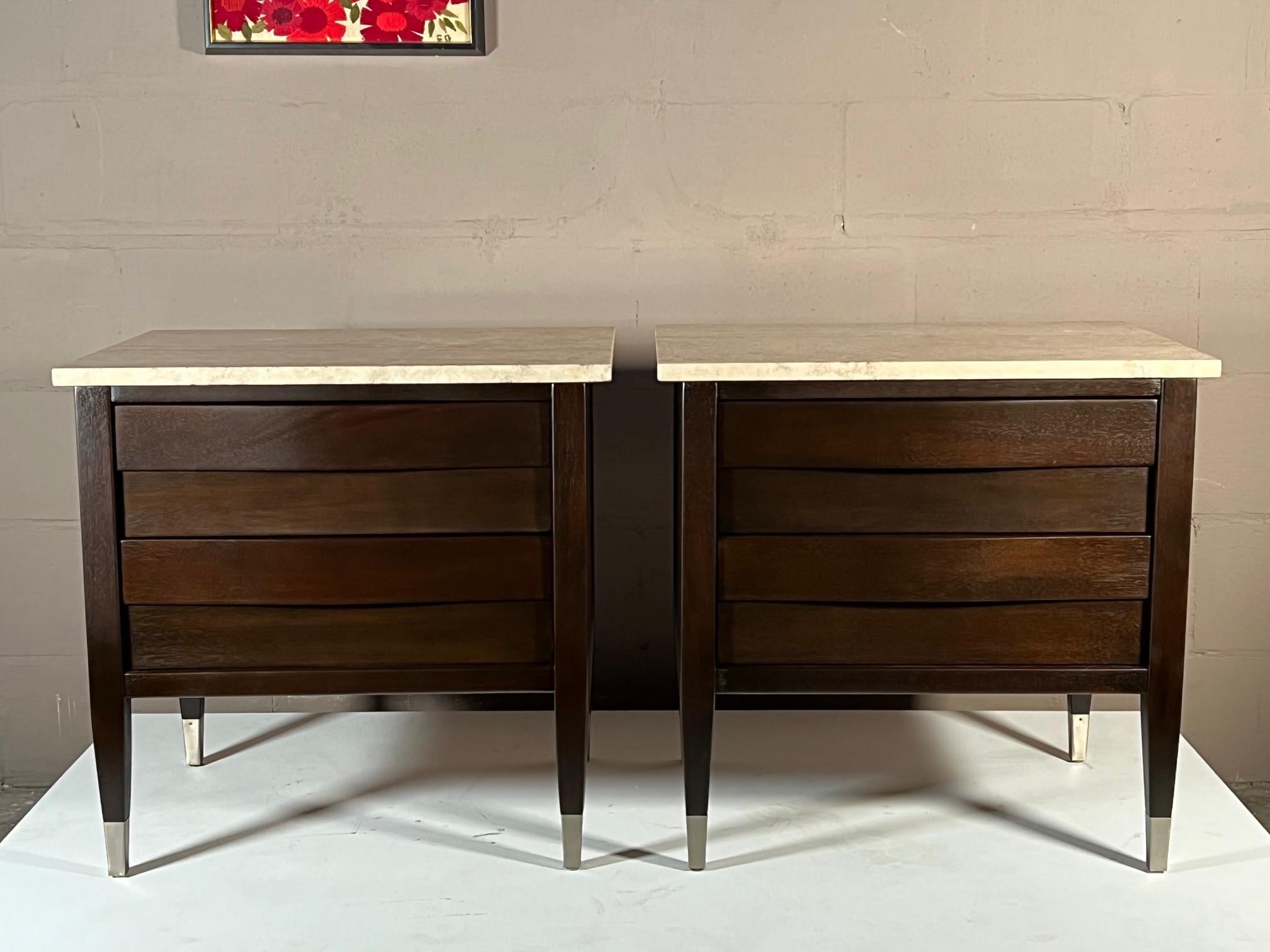 Classic and elegant mid century night stands by American of Martinsville. Reminiscient of Gio Ponti style, they have tapered legs with sabots, travertine tops-made in Italy, bowed drawer fronts are an additional feature. Refinished in a dark brown