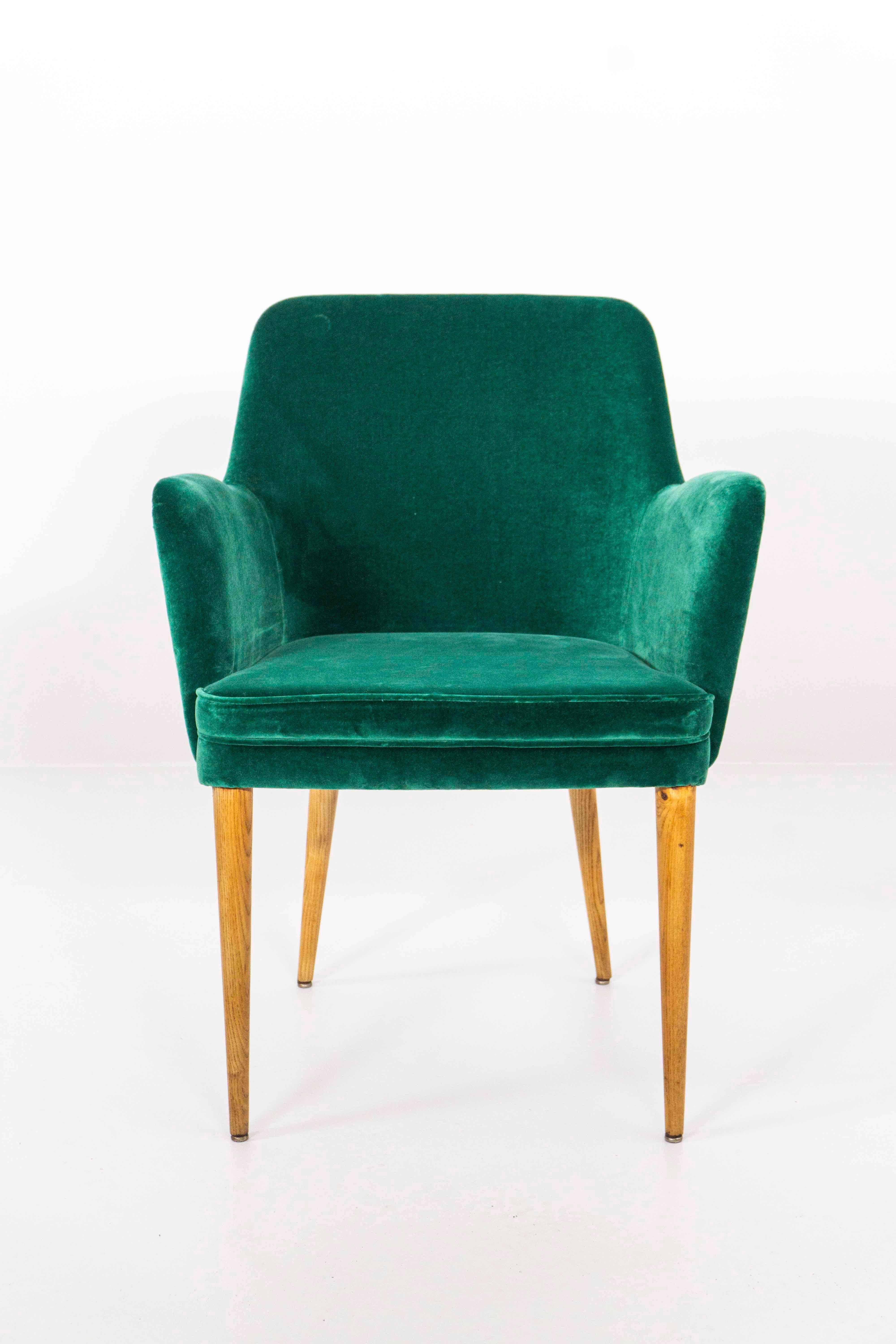 Two elegant and fine arm chairs (Model P 35) by Italian architect and designer Osvaldo Borsani. The chairs can be bought as a pair or individually.

Upholstered seat, velvet cover and upholstery renewed with a high-quality velvet by the Italian