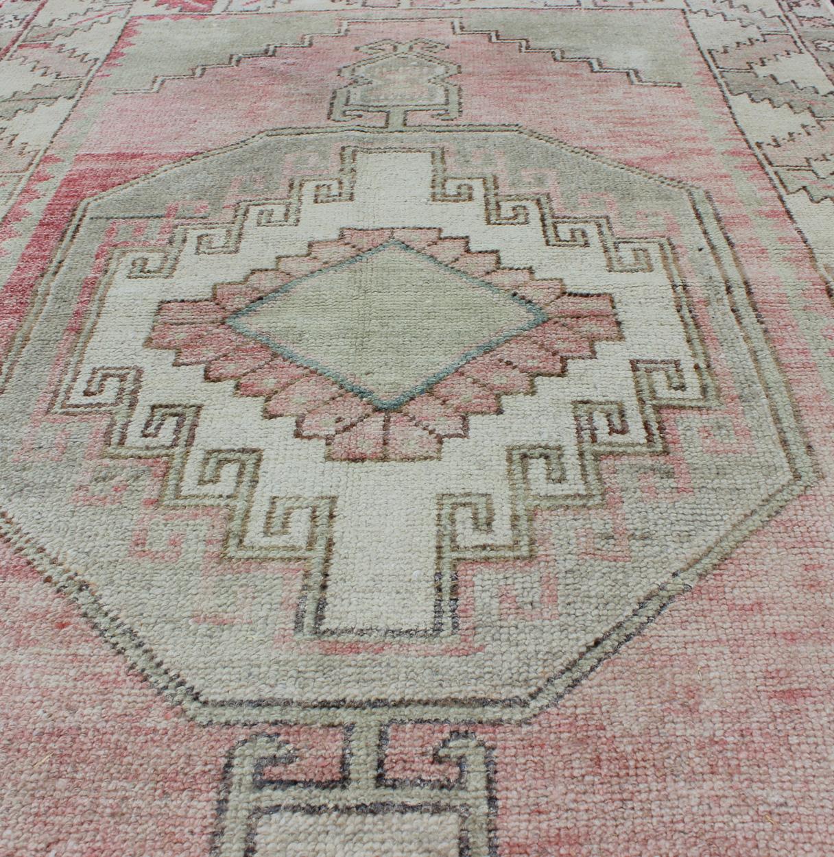 Hand-Knotted Elegant Oushak Rug from Turkey with Tribal Medallion Design in Light Colors For Sale