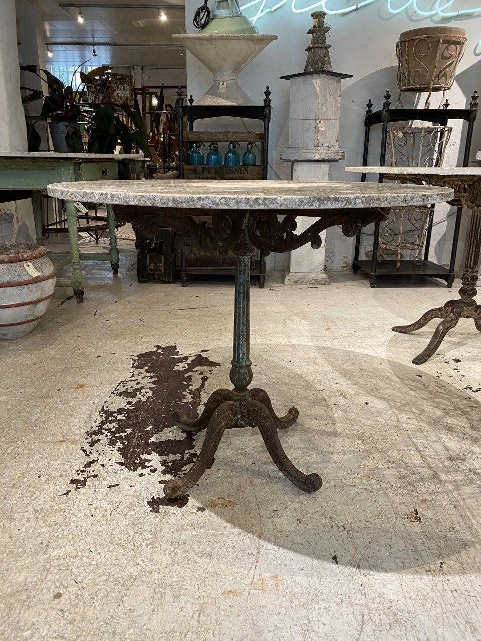 Elegant vintage French garden table with beautifully twisted base and legs, designed in blue-green patinated wrought iron with a rustic look. The table has a nice big solid circular grey marble top with nice weathered patina and easily seats 4 for a