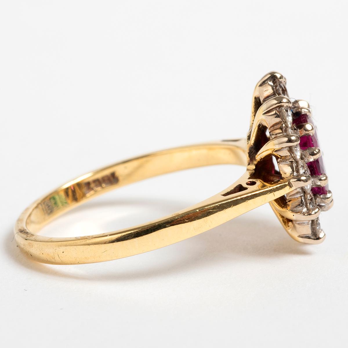 This elegant oval ruby and diamond cluster ring is approx 0.50ct in weight. The ring is UK size L / US size 5.75. A very attractive ring