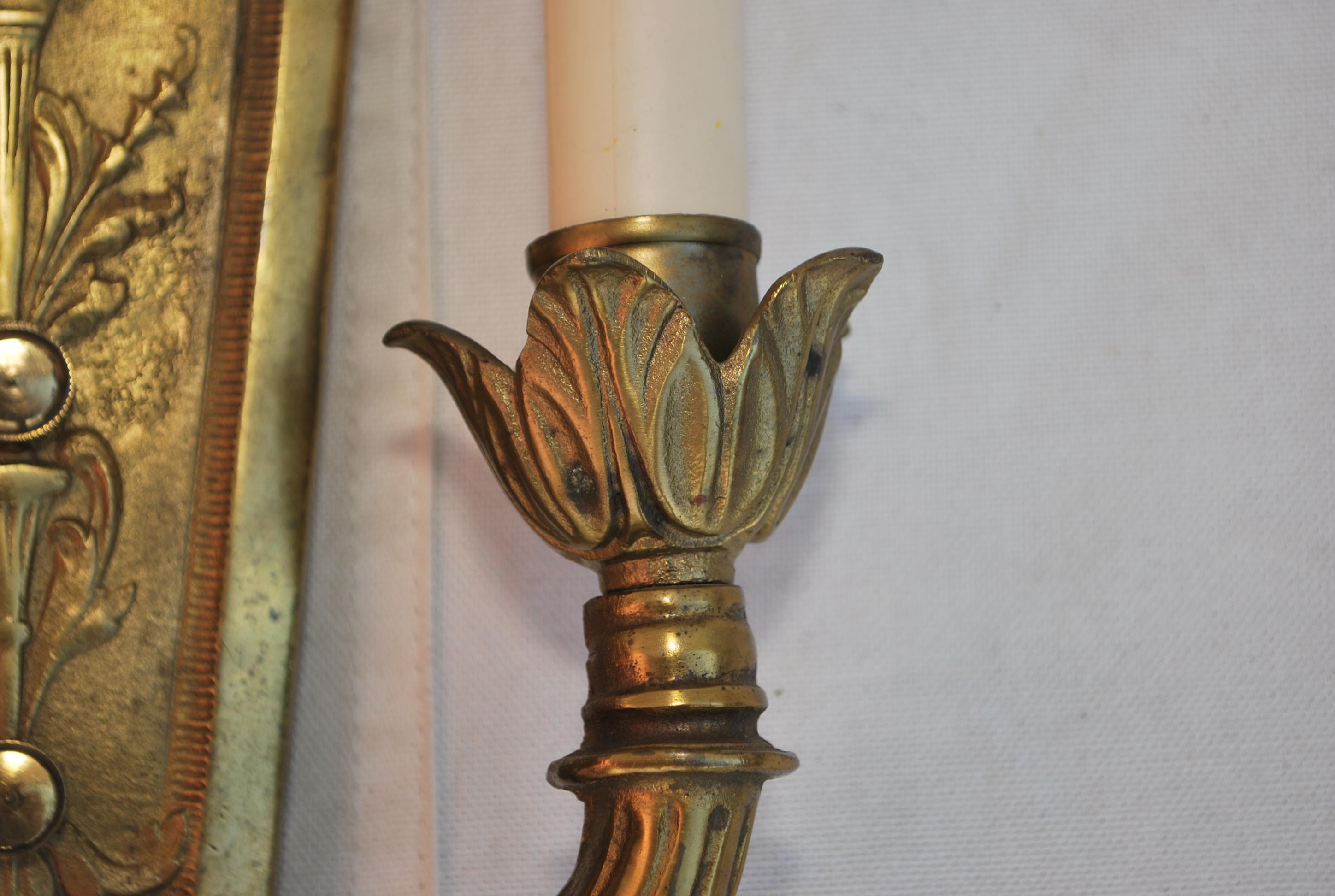 A beautiful pair of 1920's solid brass sconces, the patina is much nicer in person