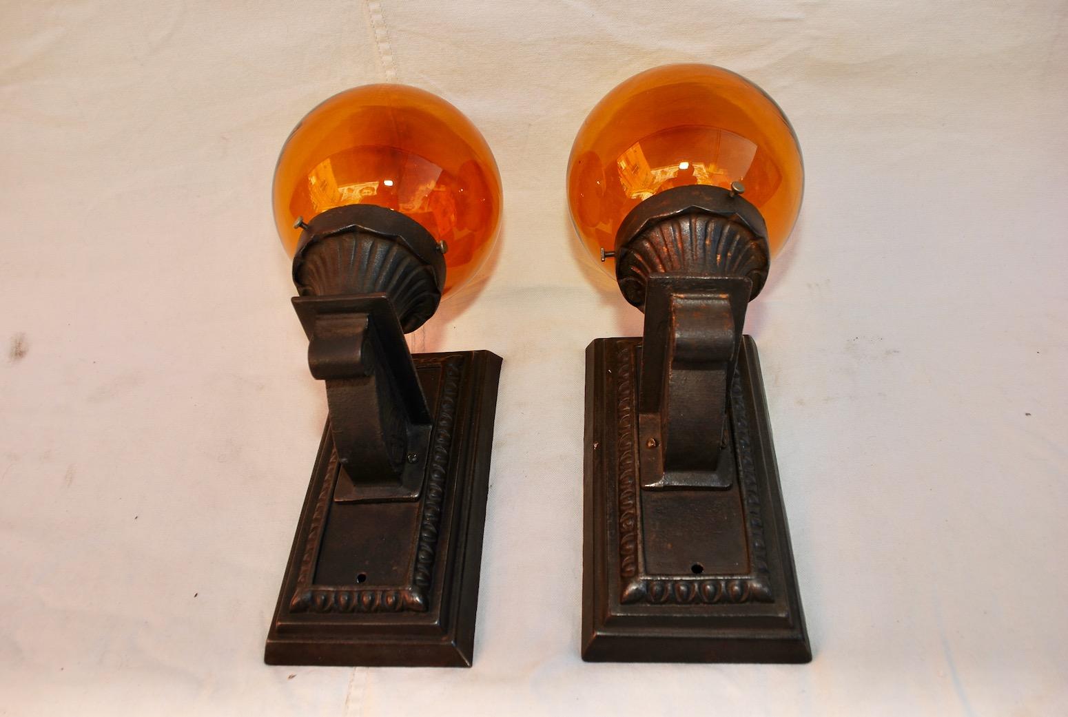 Early 20th Century Elegant Pair of 1920s Cast Iron Outdoor Sconces