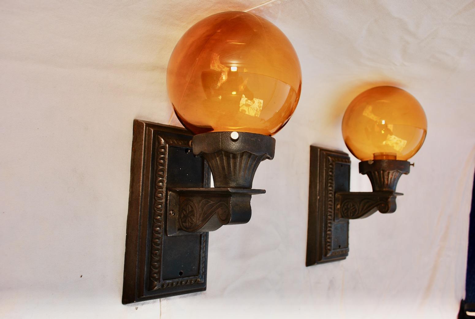 Glass Elegant Pair of 1920s Cast Iron Outdoor Sconces