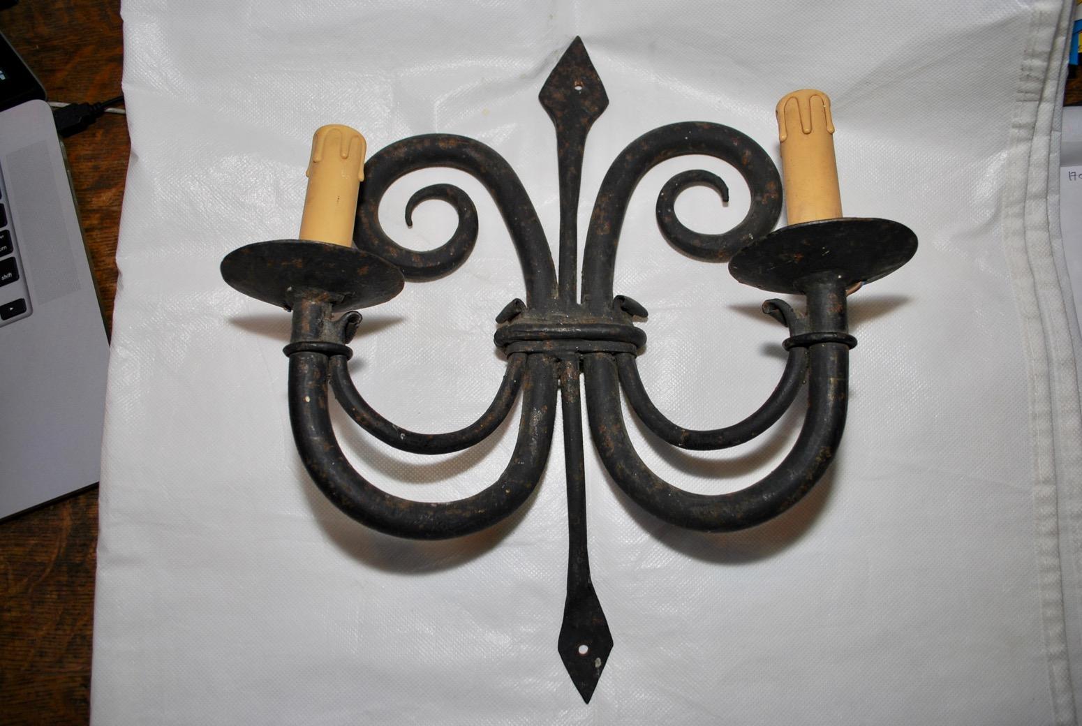 These handmade sconces are quit heavy, the quality is there, the patina is much nicer in person.

 