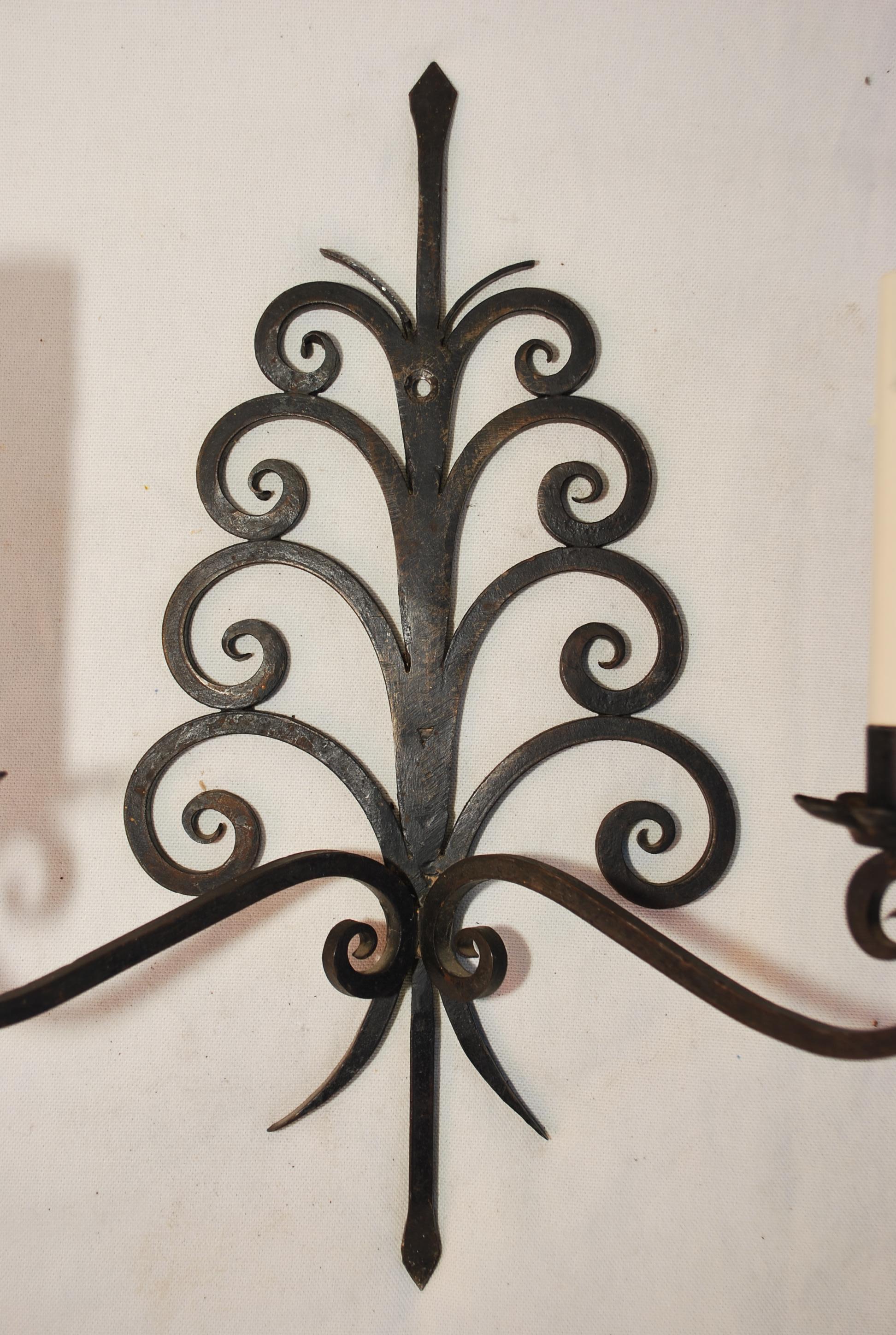 Wrought Iron Elegant pair of 1920's French wrought iron sconces For Sale