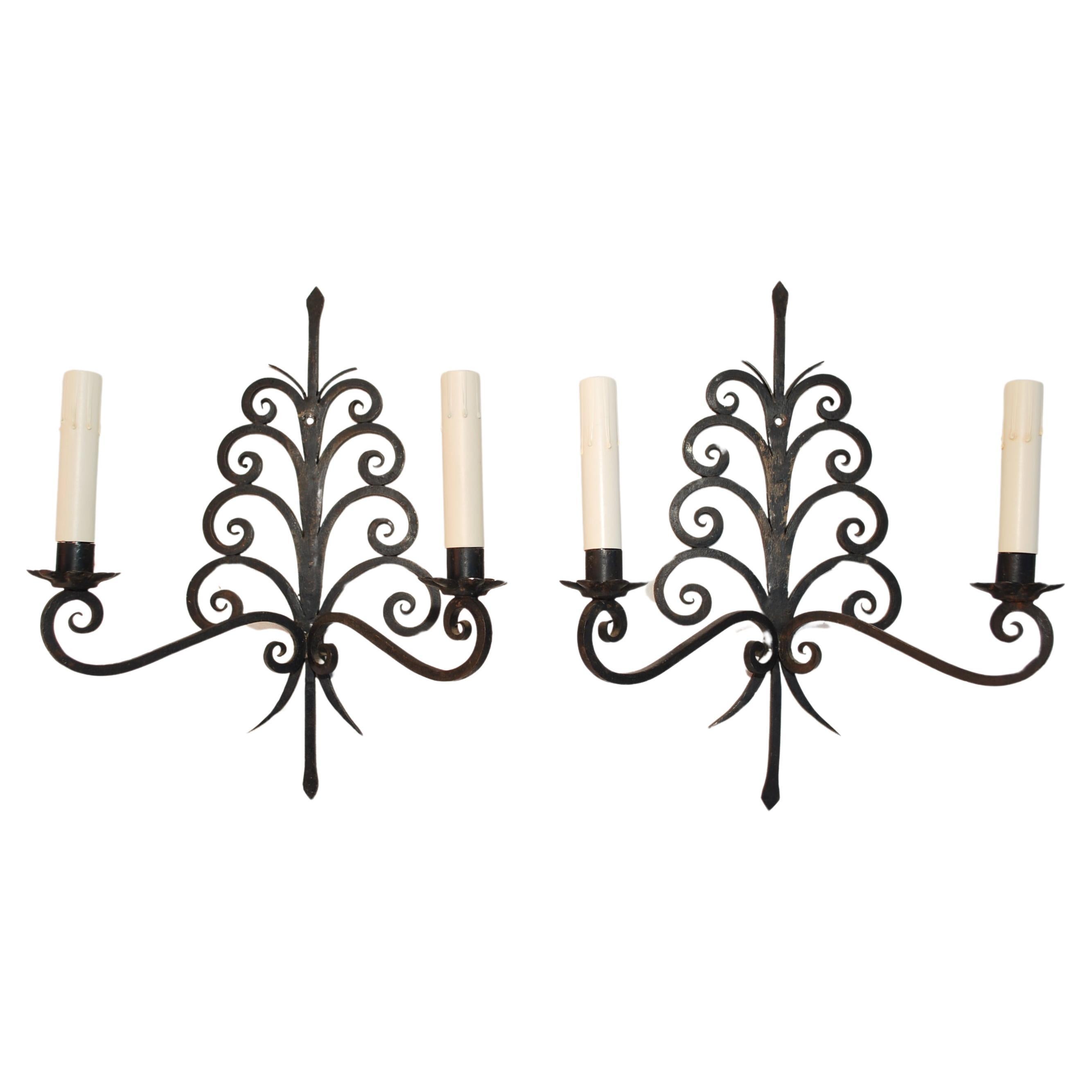 Elegant pair of 1920's French wrought iron sconces For Sale