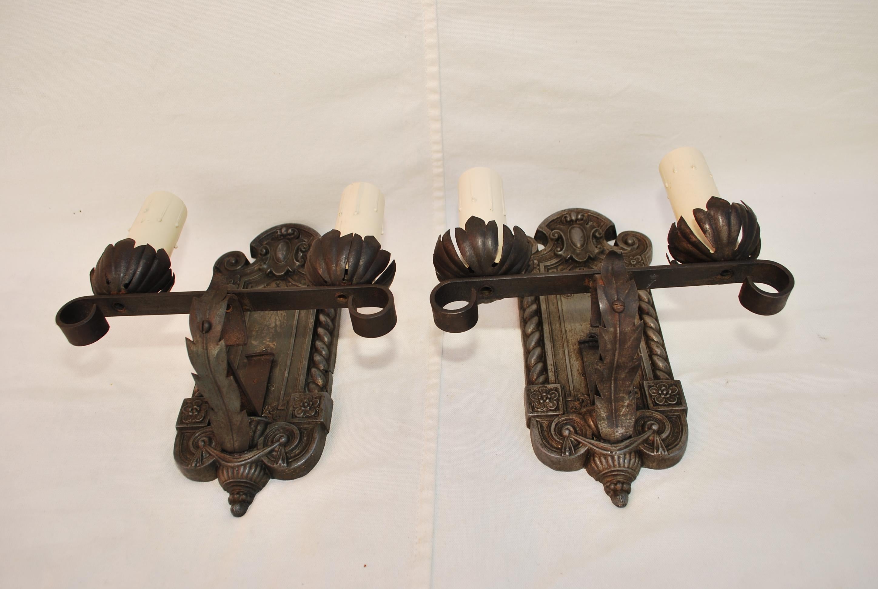 An elegant pair of 1920's sconces, the patina is allot nicer in person