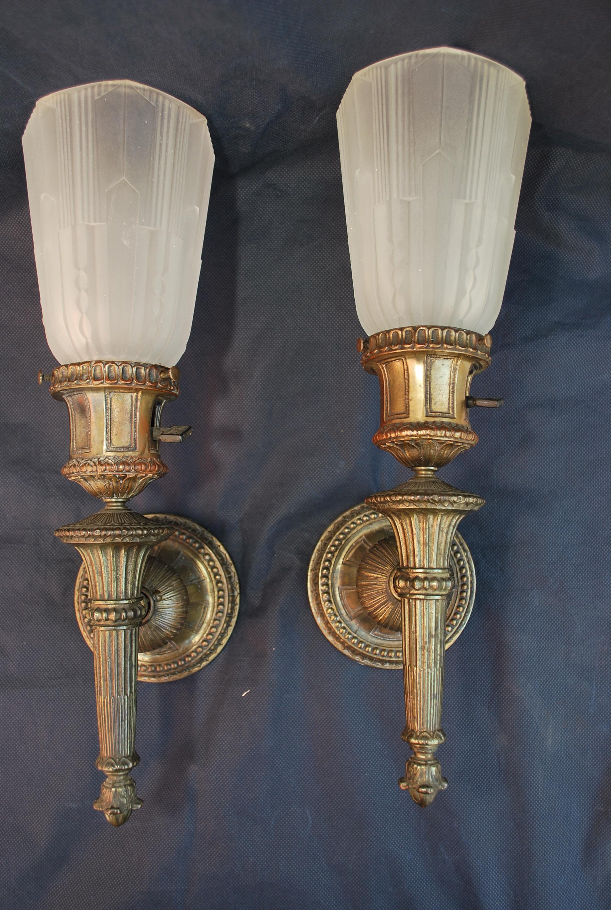 An elegant pair of 1920's silver plated sconces, the patina is much nicer in person