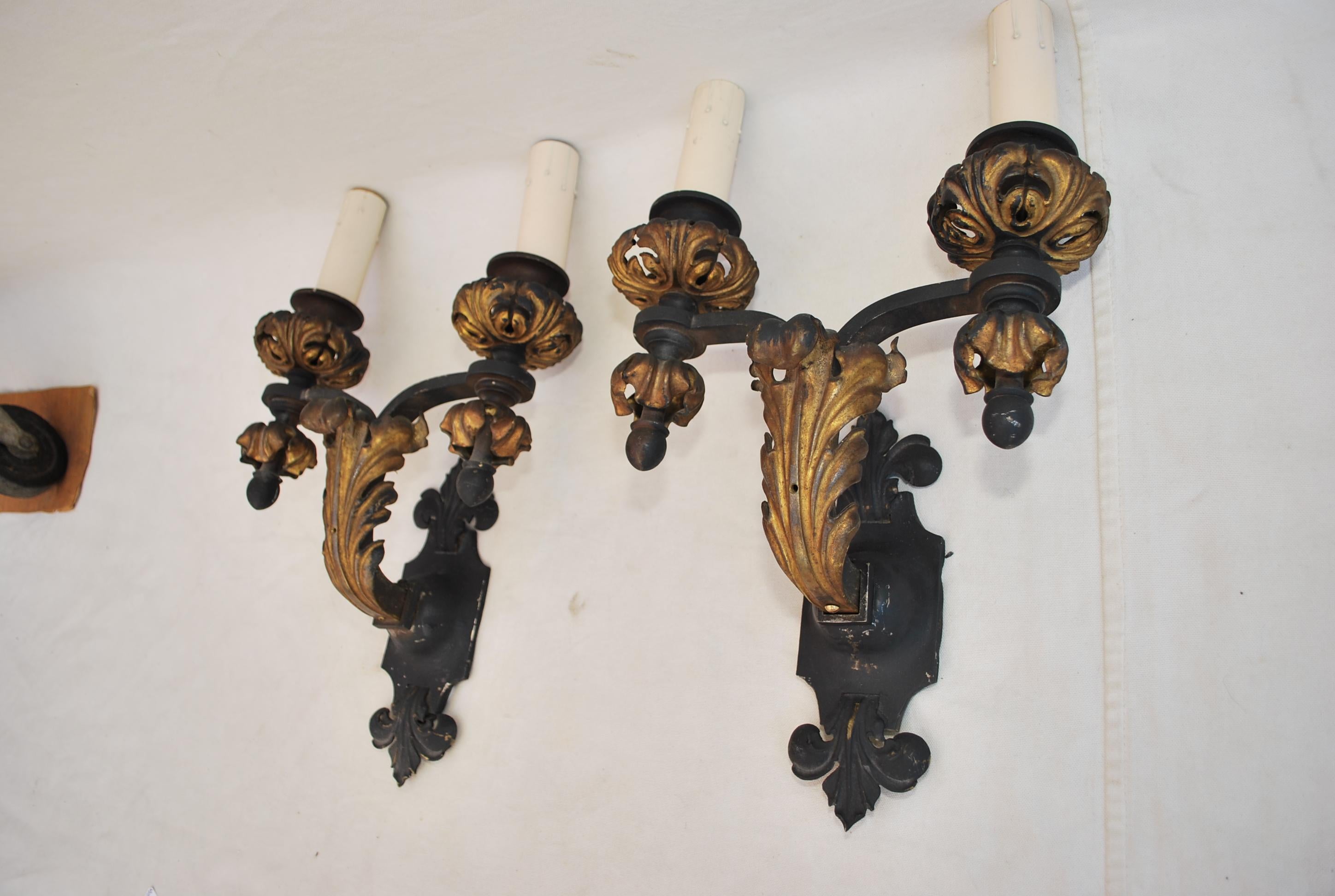 A beautiful and rare pair of 1920's all hands made wrought iron sconces, the patina is so much nicer in person.
