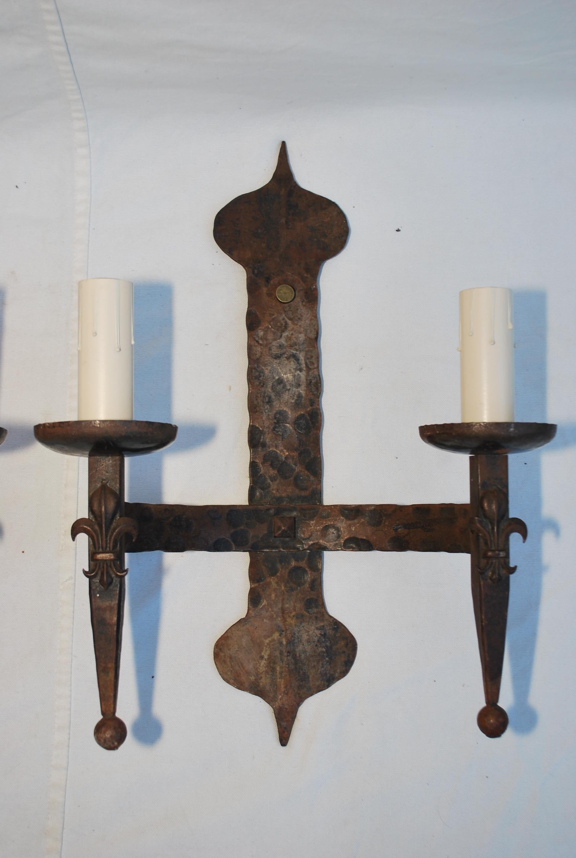 A very nice all hands made wrought iron sconces, the patina is so much nicer in person