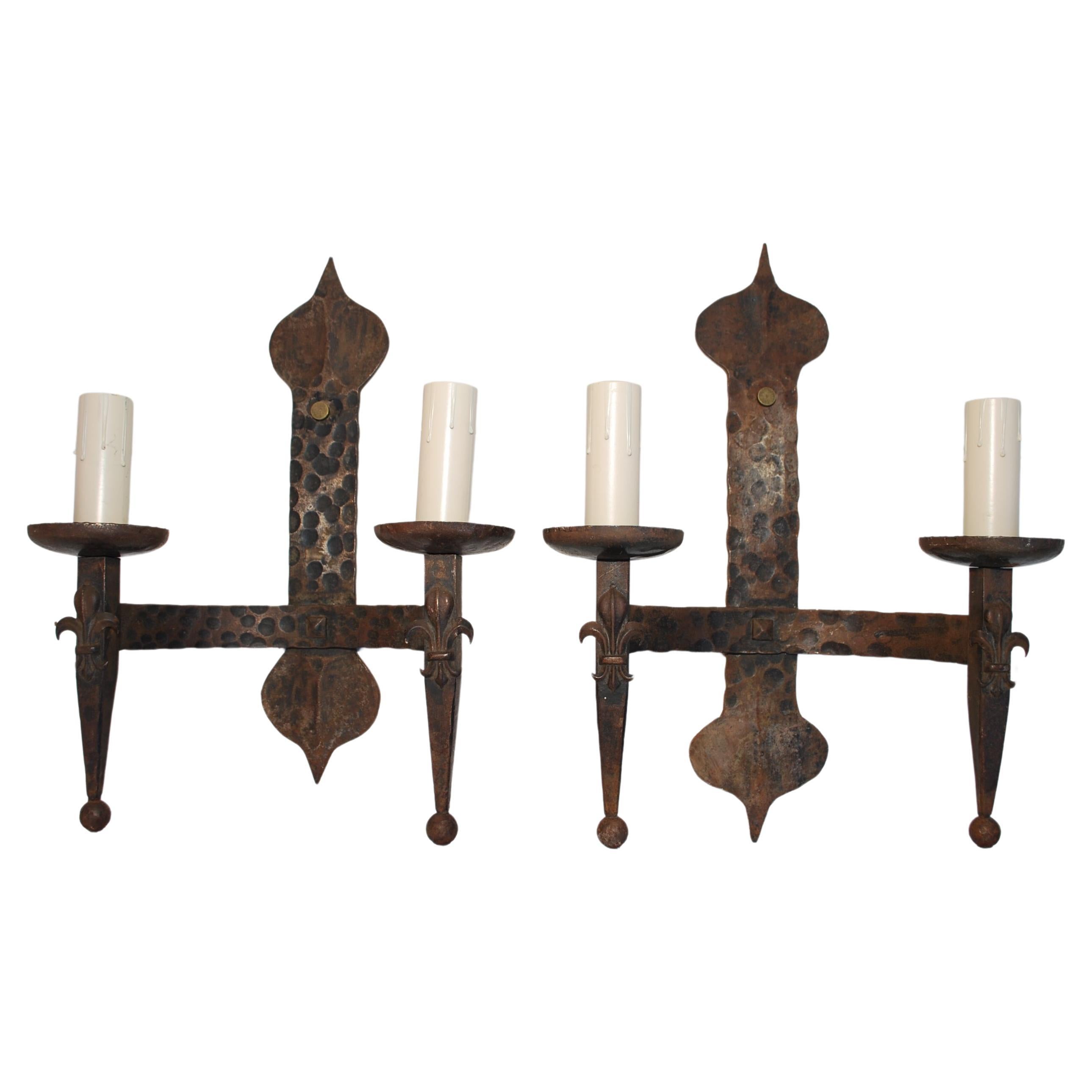Elegant pair of 1930's wrought iron sconces For Sale