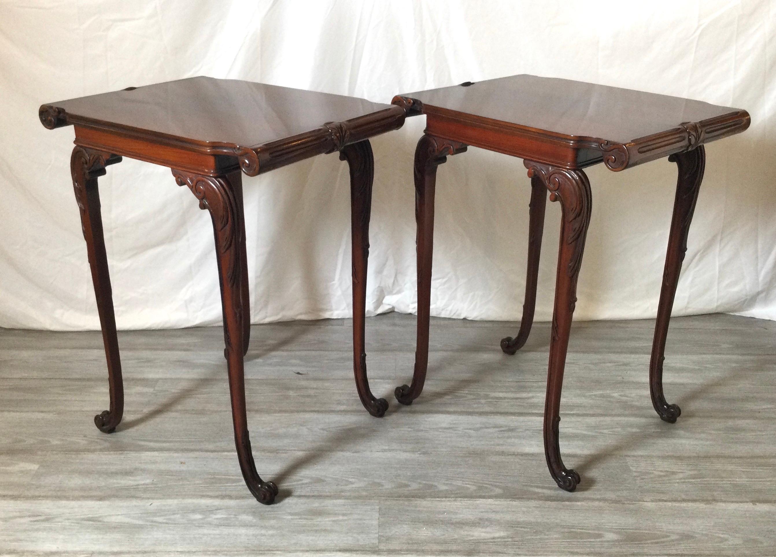 Elegant pair of antique mahogany side tables. Removable glass cut to form tops. Very stylish carved ends and delicate legs. Measures: 22