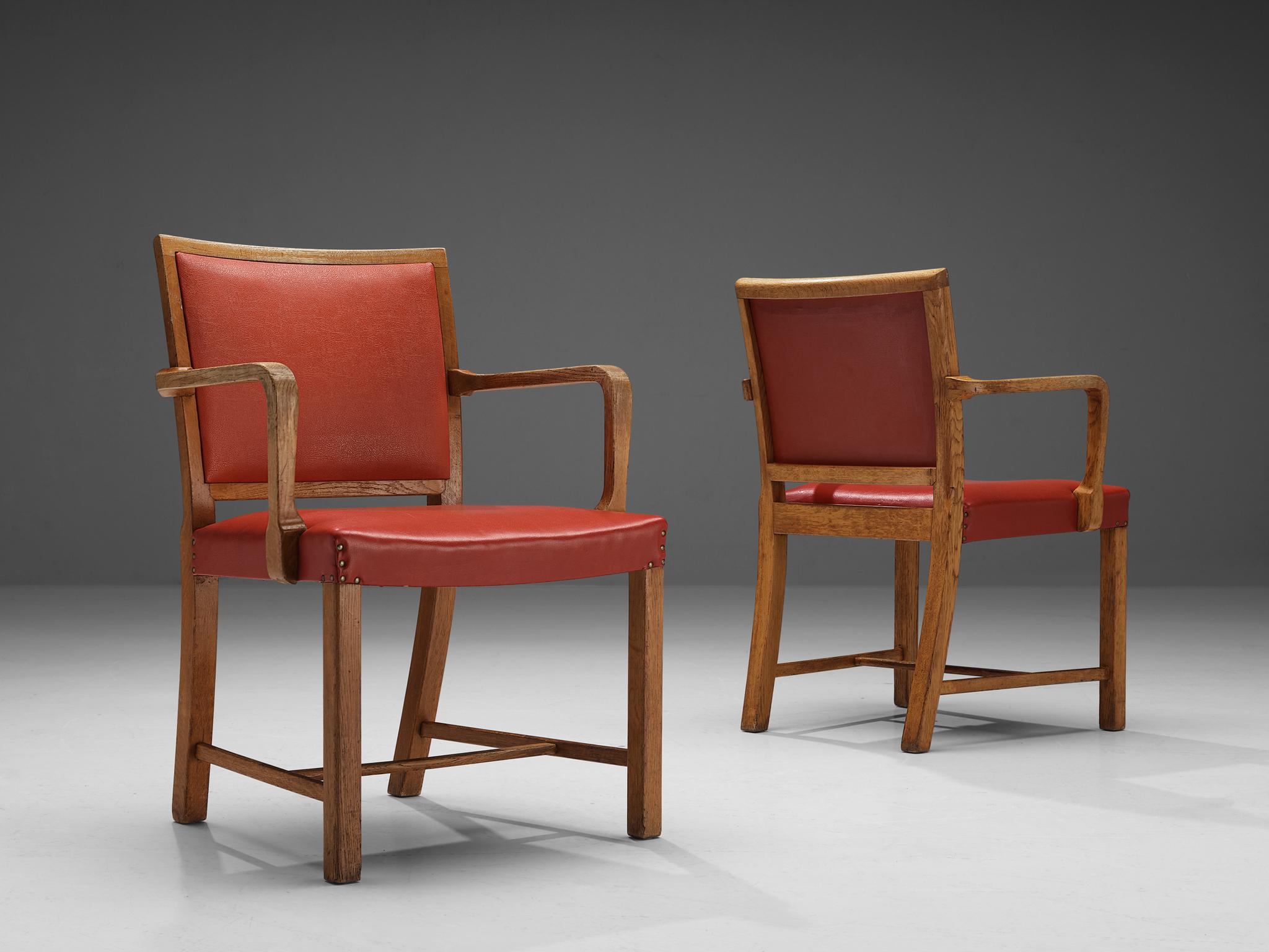 Armchairs, leatherette, oak, brass, Europe, 1960s.

This sculptural pair of armchairs resembles the design by the architects of BBPR. The model with a wide seat has a characteristic, sculptural frame. The tilted legs with sharp edges create an