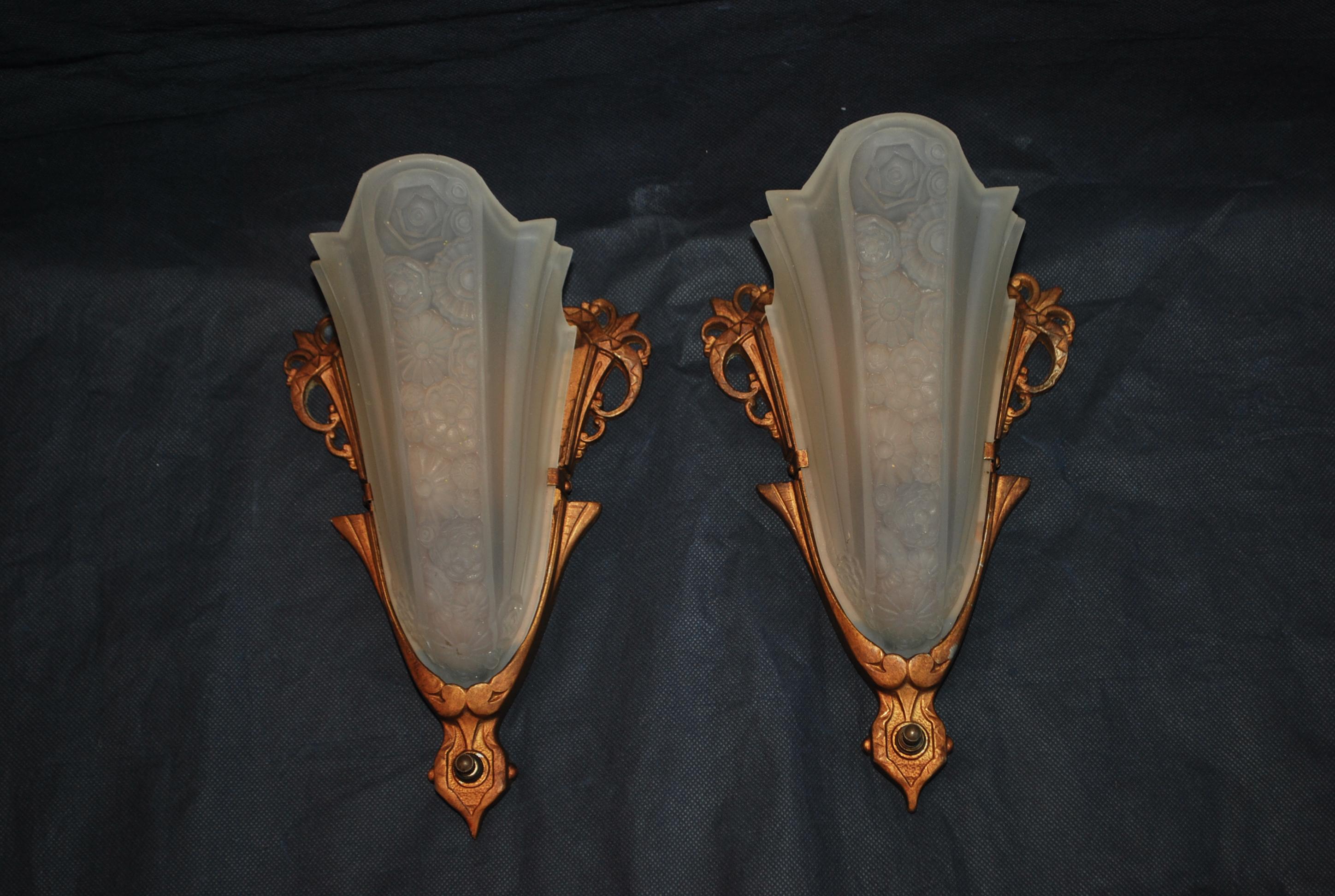 A beautiful pair of Art deco sconces, the patina is much nicer in person