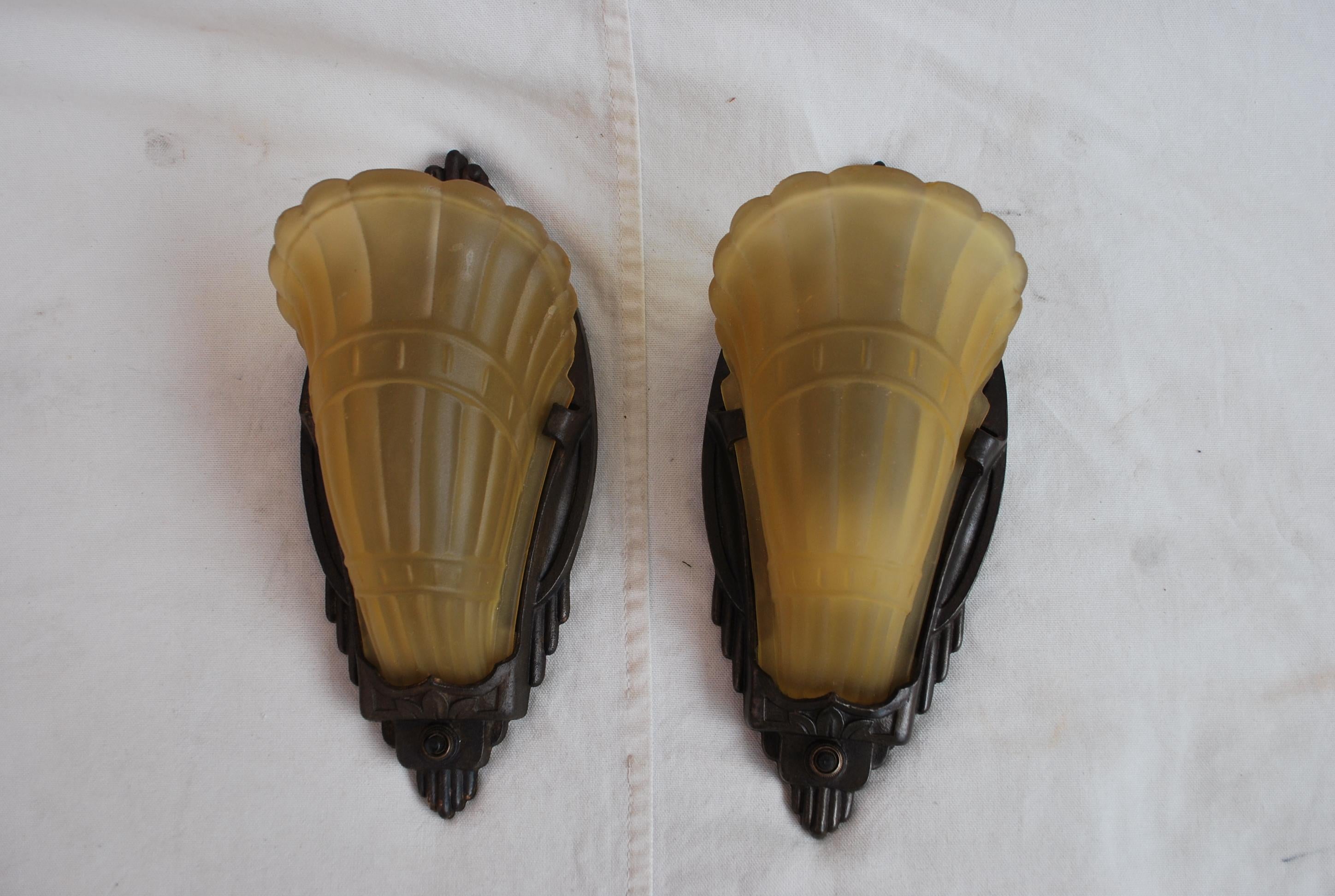 A beautiful pair of 1920's Art deco sconces, the color and the patina is so much nicer in person