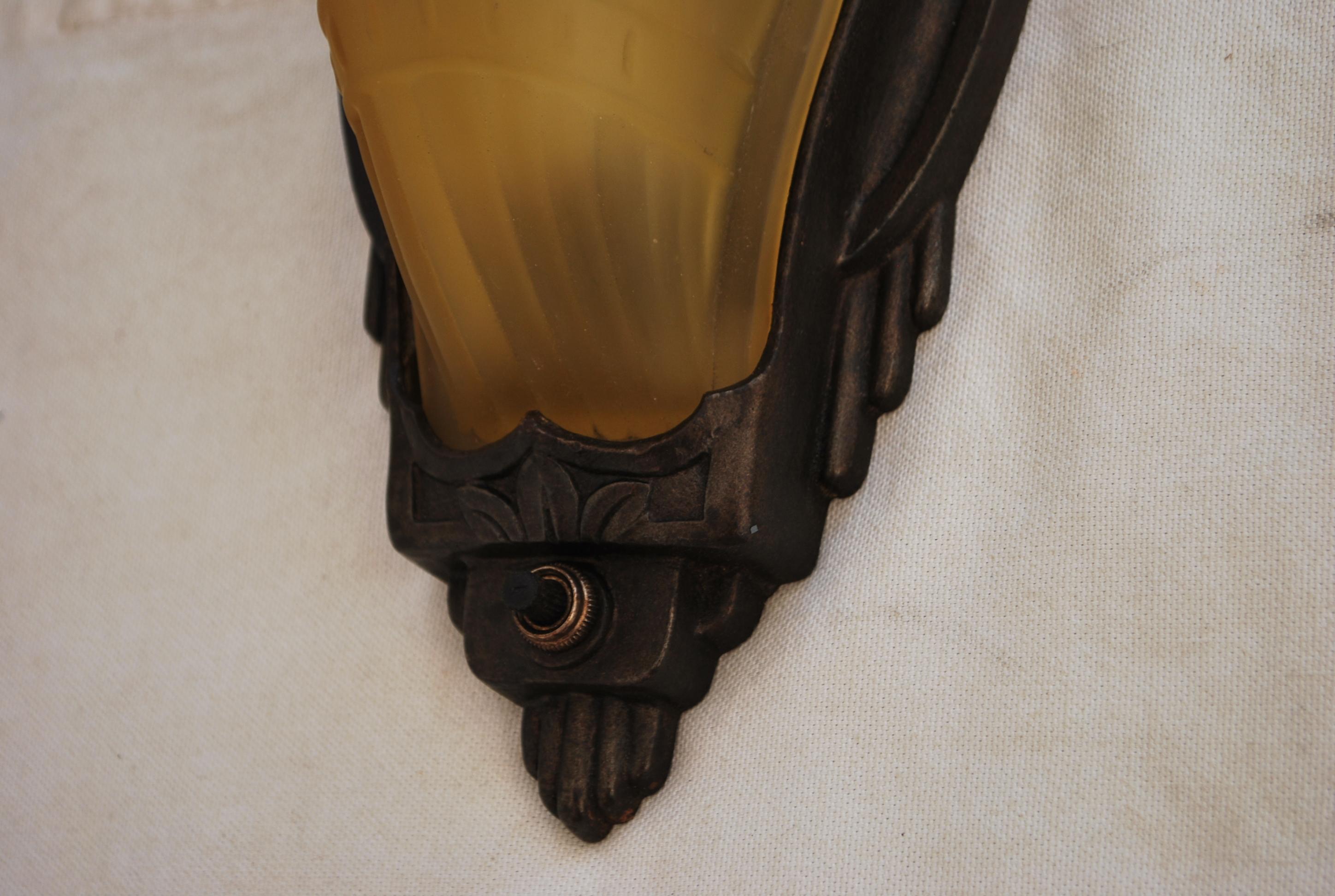 Cast Elegant pair of Art Deco sconces For Sale
