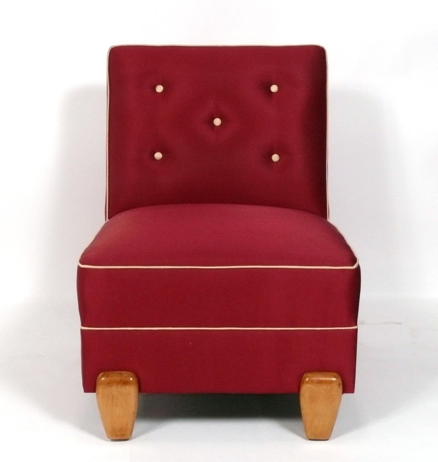 Elegant pair of Art Deco style slipper chairs, believed to be American, circa 1980s. This pair of chairs is currently being reupholstered and can be completed in your fabric. Simply send us 11 yards total of your fabric after purchase.