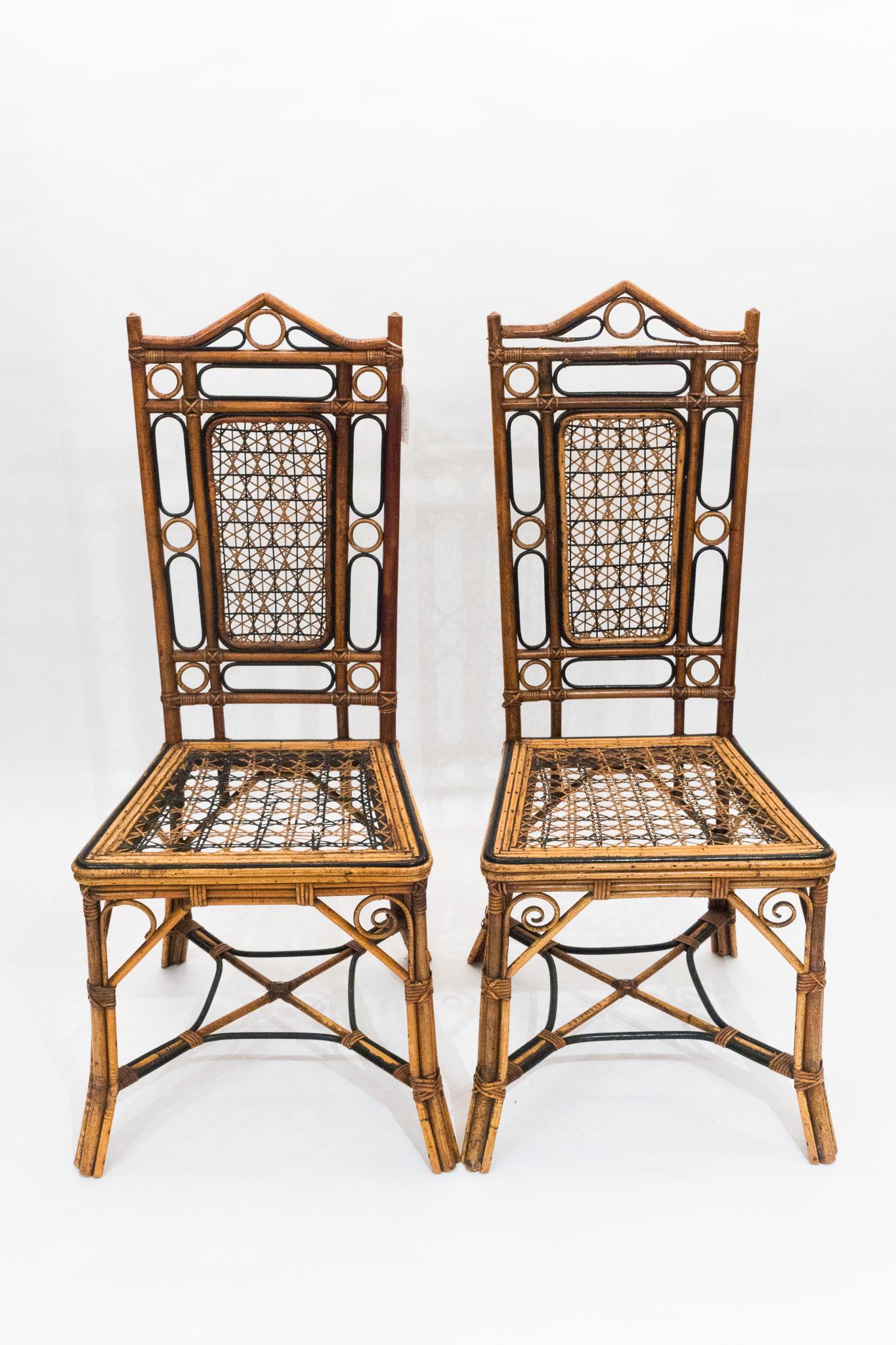 Elegant pair of bamboo and wicker chairs. Needs some miner repair and one seat is in need of a bit of re-caining.