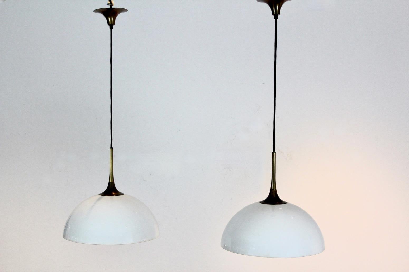 German Elegant Pair of Brass and White-Opal Glass Pendant Lights by Florian Schulz For Sale
