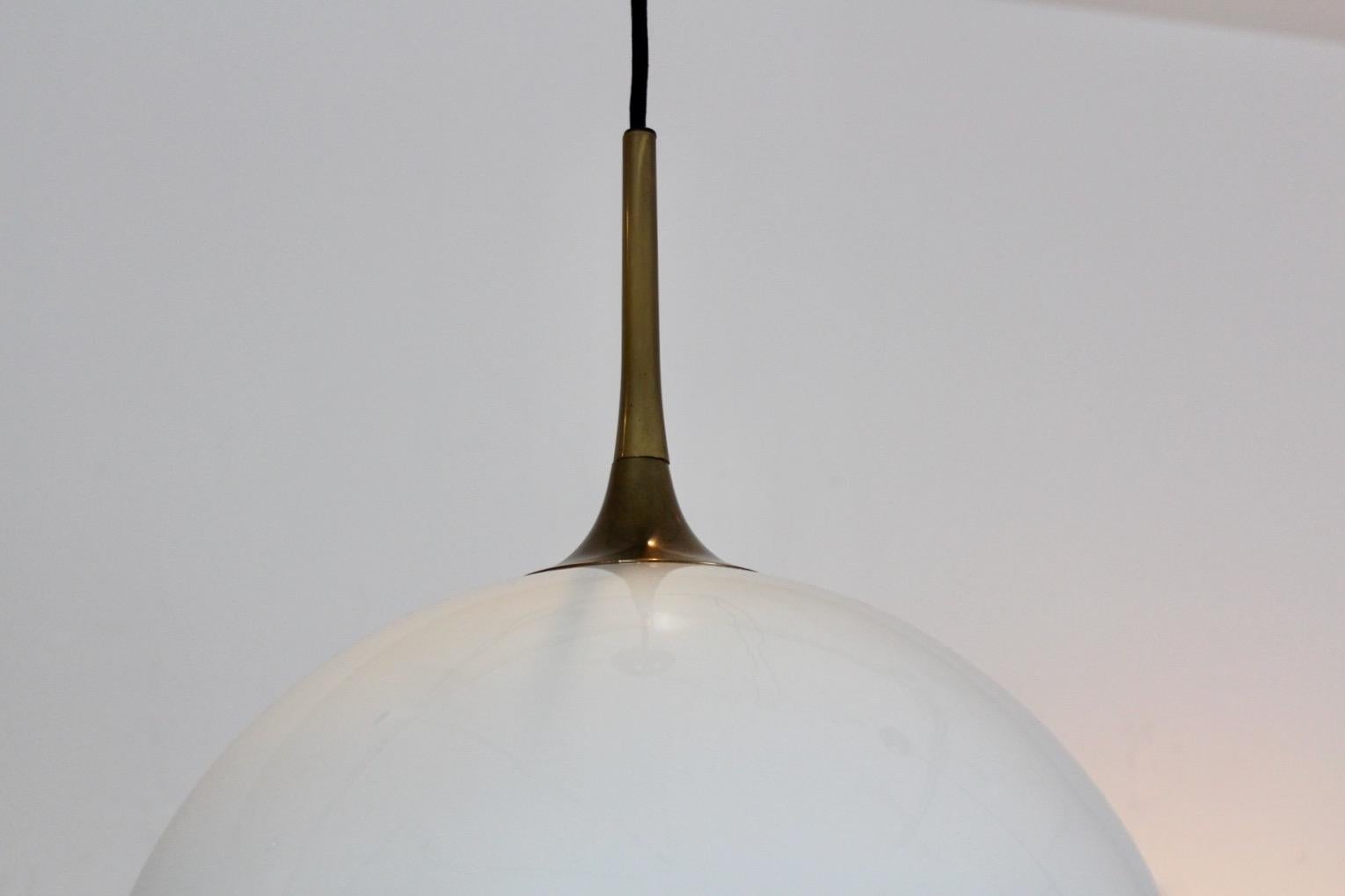 20th Century Elegant Pair of Brass and White-Opal Glass Pendant Lights by Florian Schulz For Sale