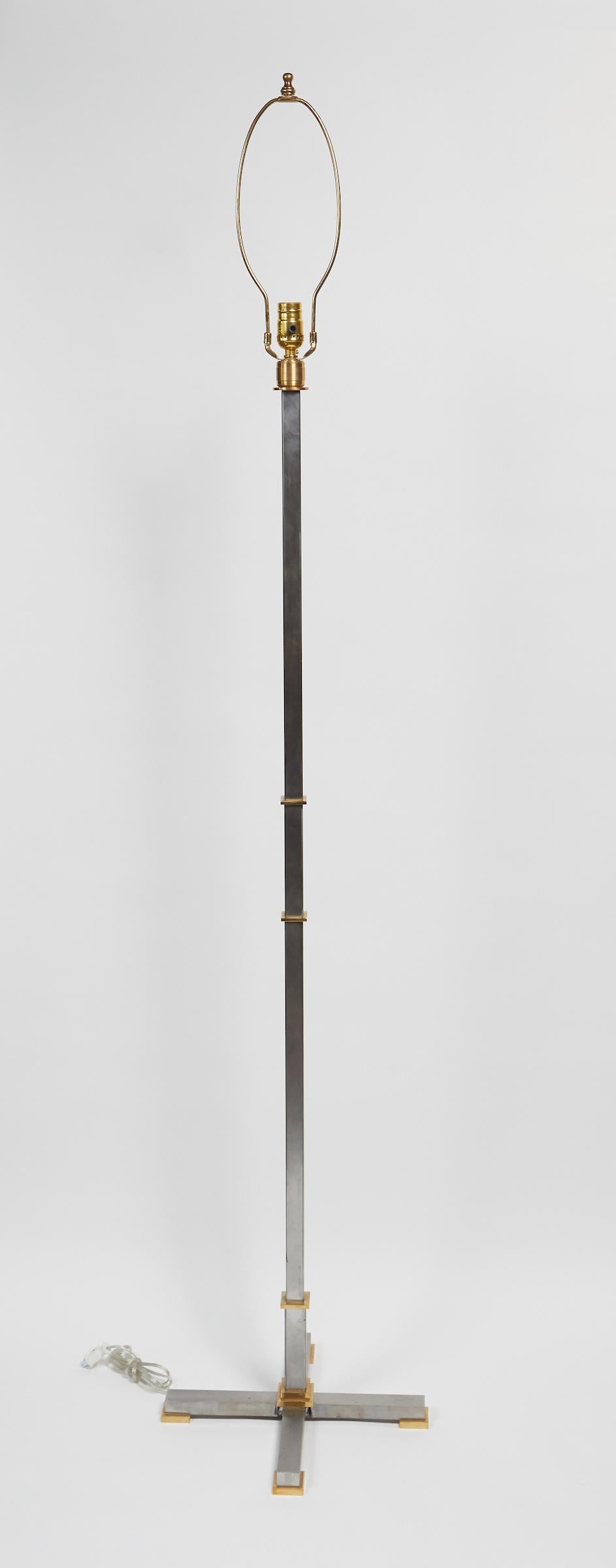 Late 20th Century Elegant Pair of Brushed Steal and Solid Brass Floor Lamps by Maison Jansen