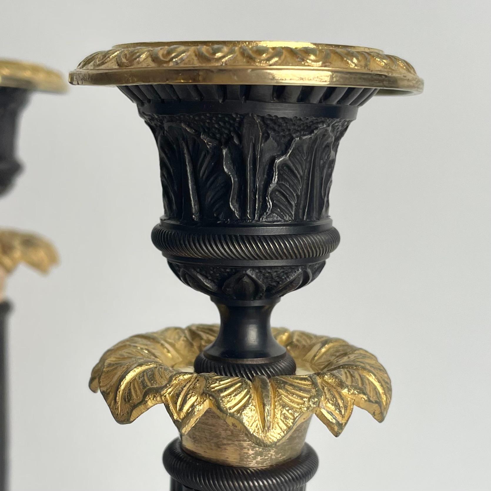 Elegant pair of Candlesticks in Louis Philippe. Dark patinated and gilded bronze For Sale 3