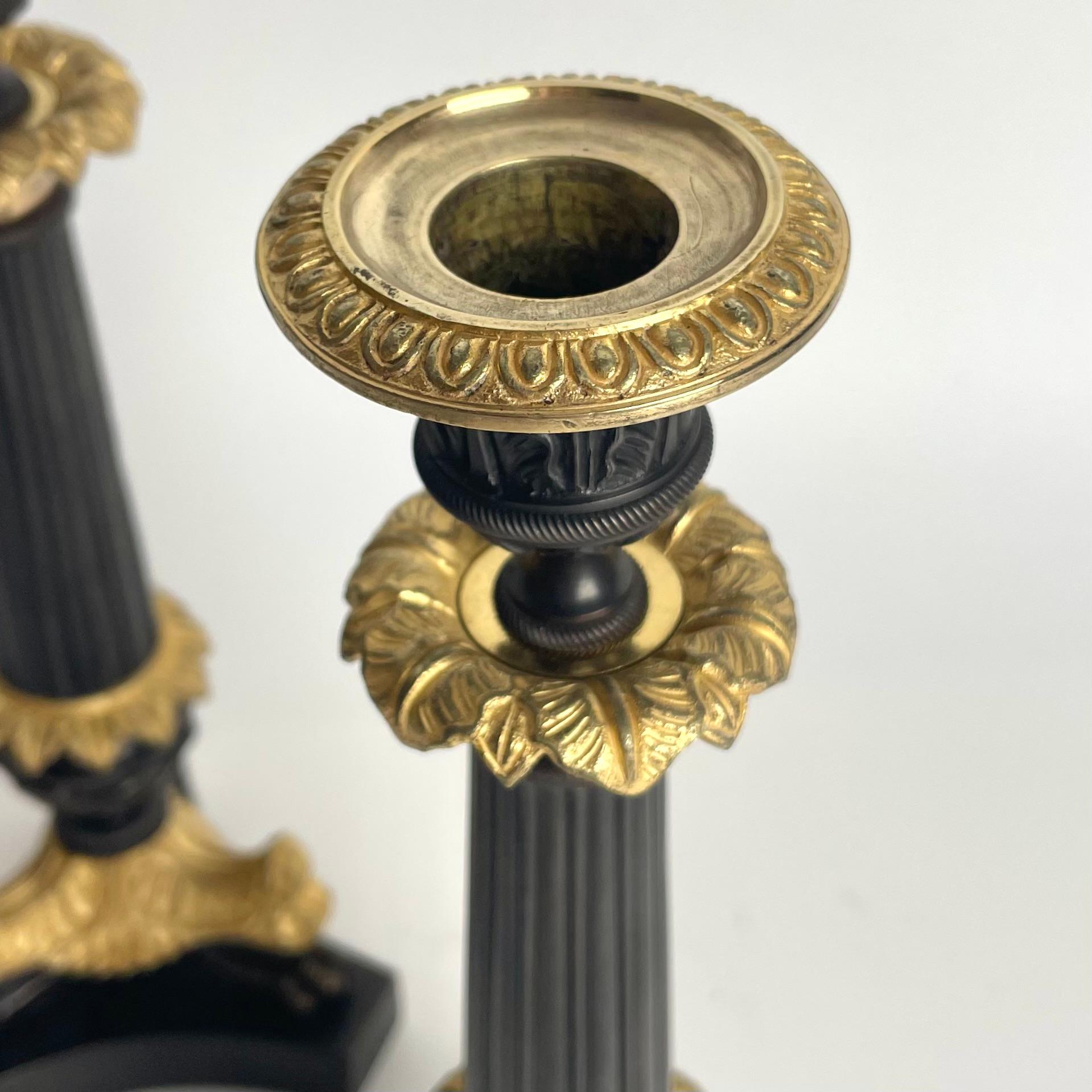 Elegant pair of Candlesticks in Louis Philippe. Dark patinated and gilded bronze For Sale 4