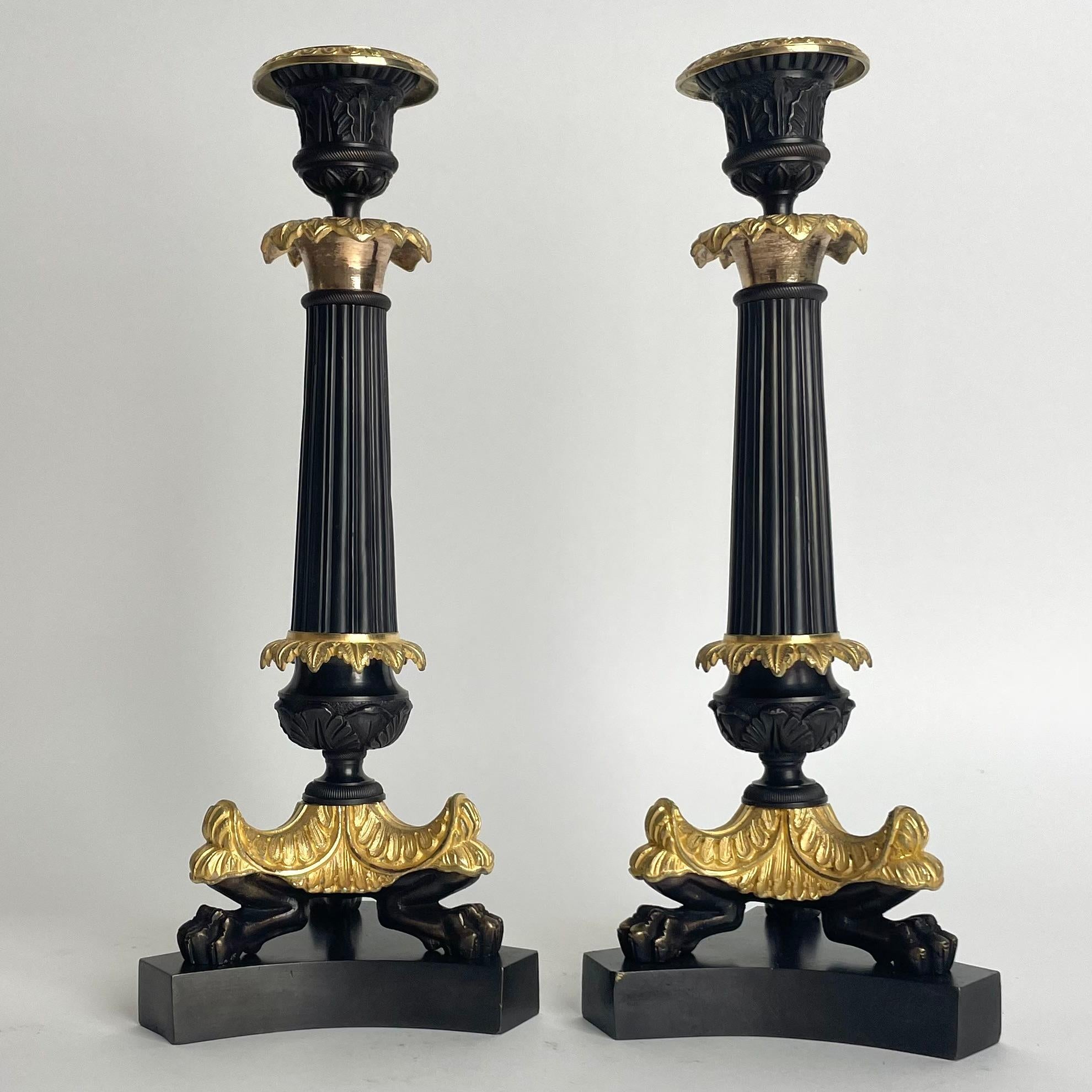 Mid-19th Century Elegant pair of Candlesticks in Louis Philippe. Dark patinated and gilded bronze For Sale