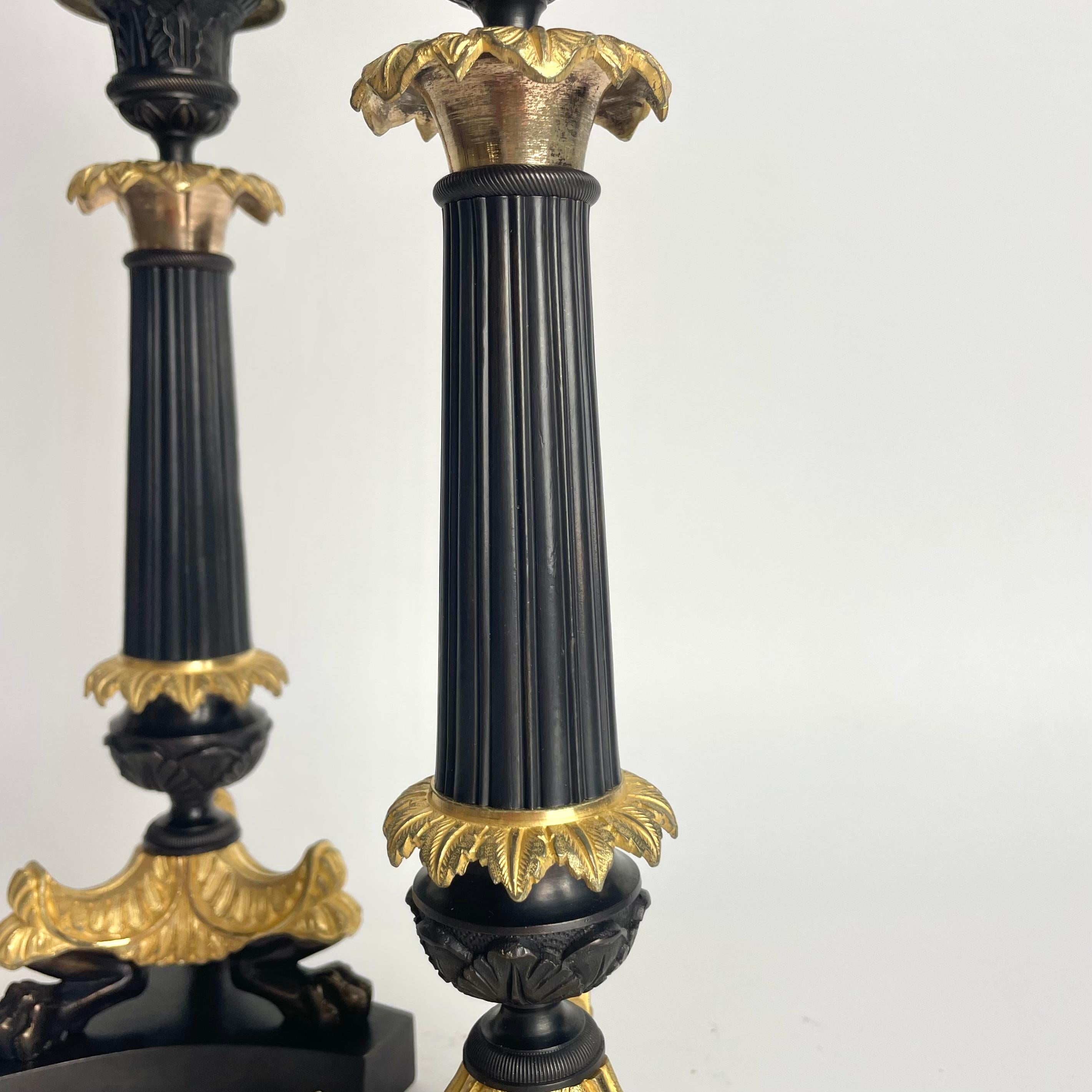 Elegant pair of Candlesticks in Louis Philippe. Dark patinated and gilded bronze For Sale 2
