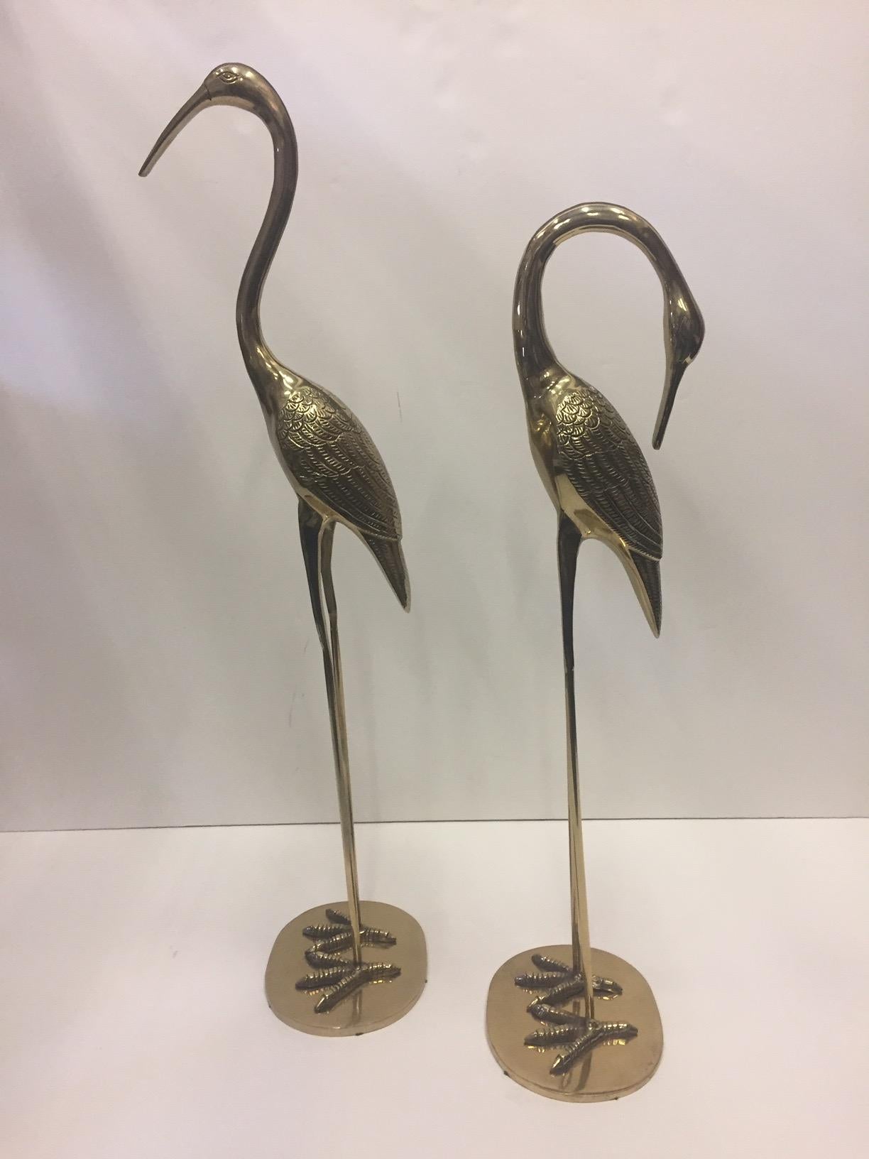 Lovely pair of cast brass cranes striking elegant poses.
Measures: One is 27.5 H, the other 32 H.
