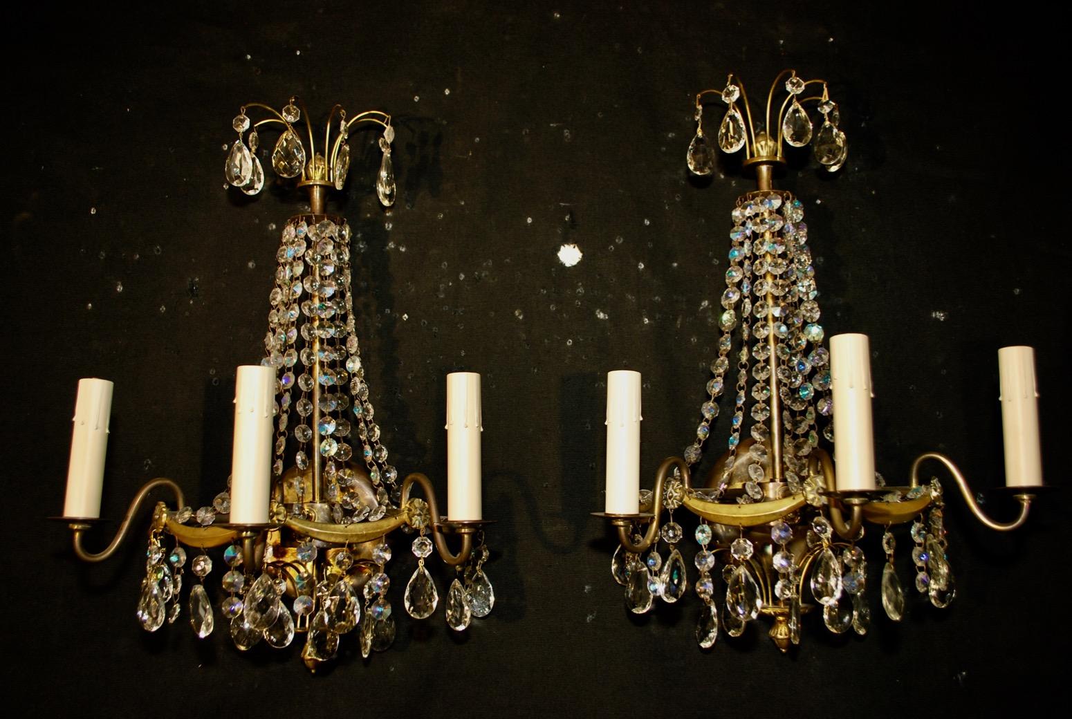 Elegant pair of crystal sconces.
 