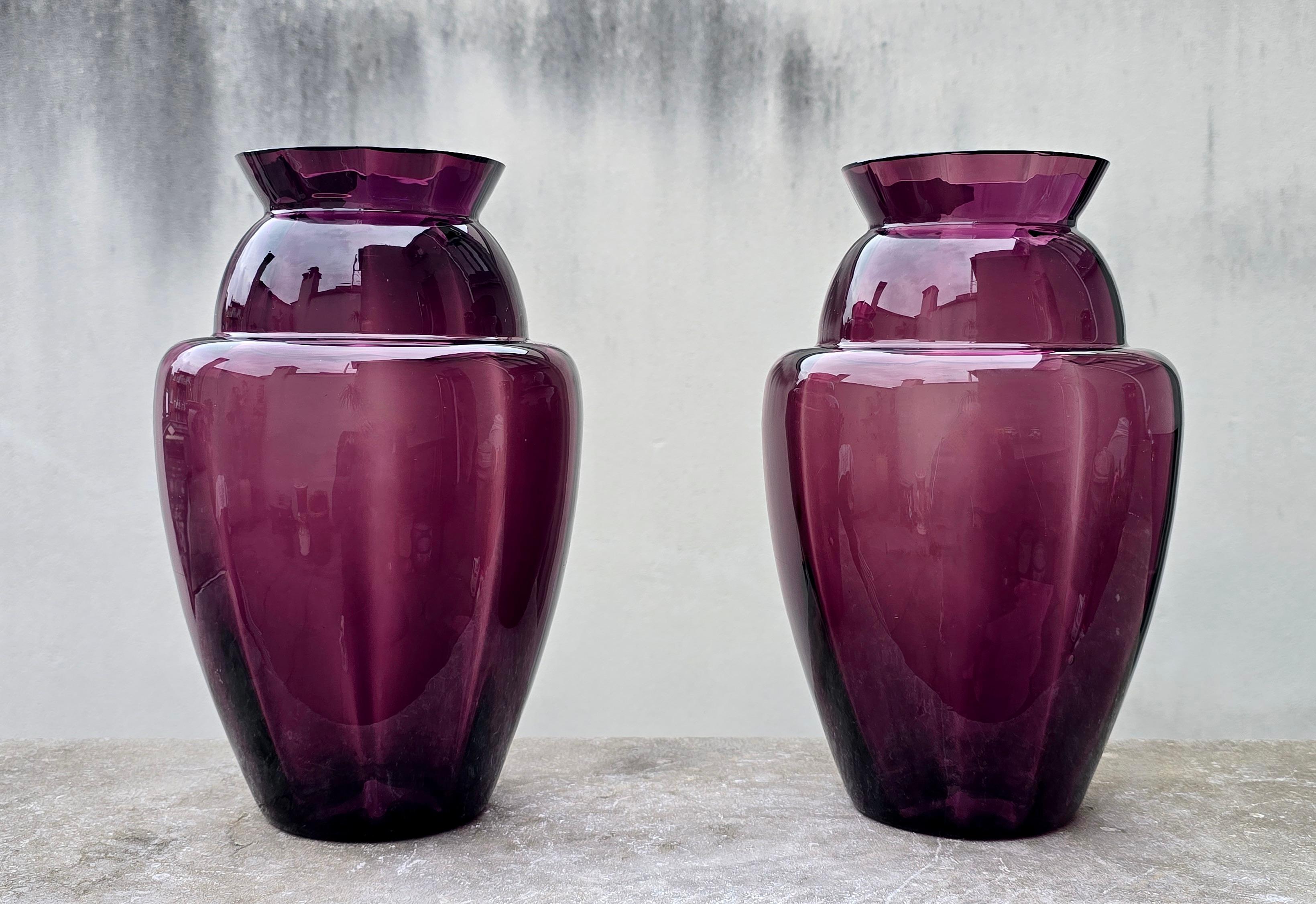 Elegant Pair of Deep Amethyst Murano Glass Vases, Hand-Blown in Italy, circa 1970s

Beautiful pair of mid-century Murano glass vases in a deep amethyst hue, gracefully shaded from dark plum at the base to a softer violet tone near the rim. Their