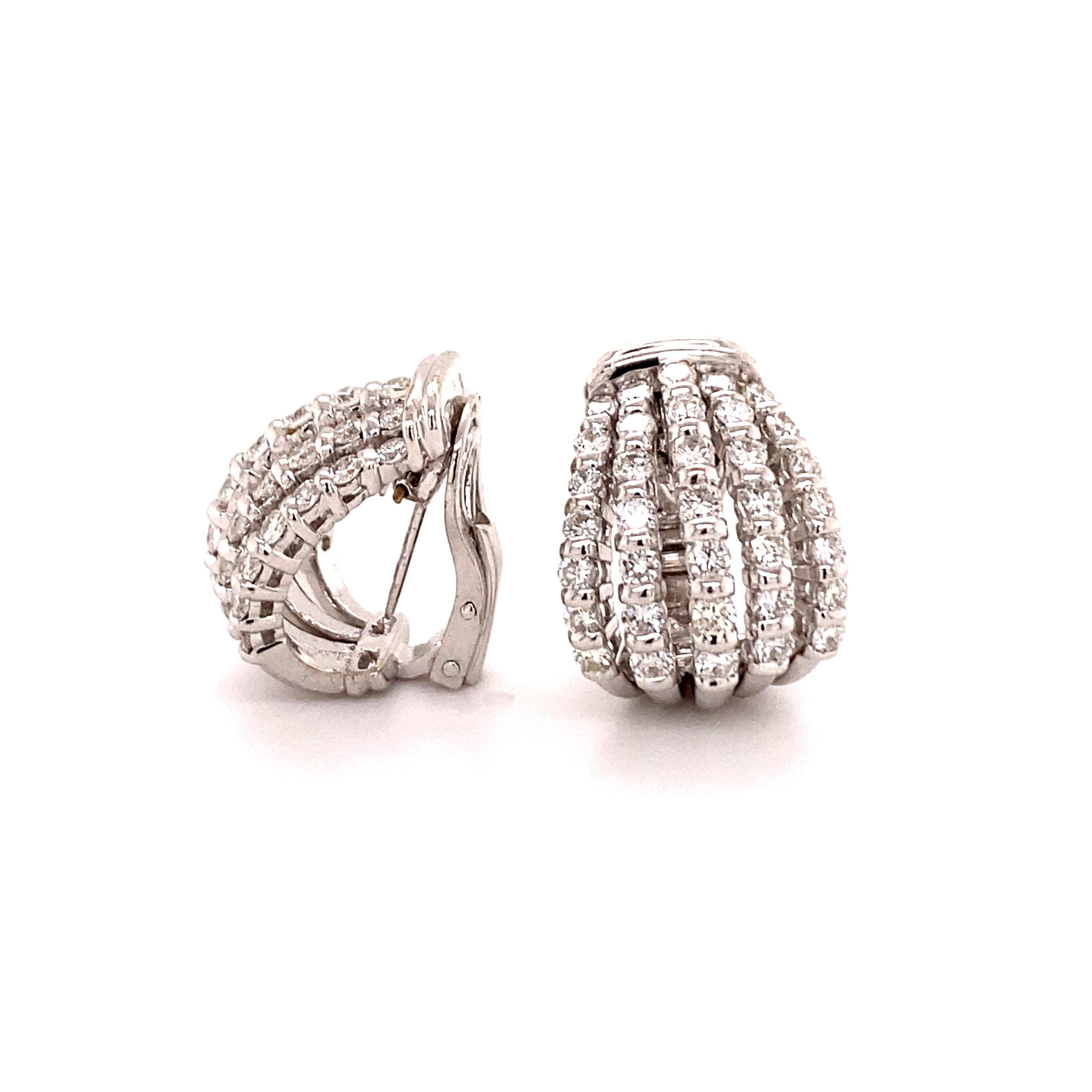 These dazzling earclips in 18 karat white gold are set with 70 brilliant-cut diamonds of G/H colour and vs/si clarity, total weight approximately 2.80 carats.
The diamonds are arranged in five slightly spaced and forward-curving vertical rows. Each