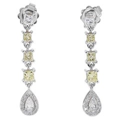 Elegant Pair of Earrings with 0.5 carat Pear Shape Natural Diamonds