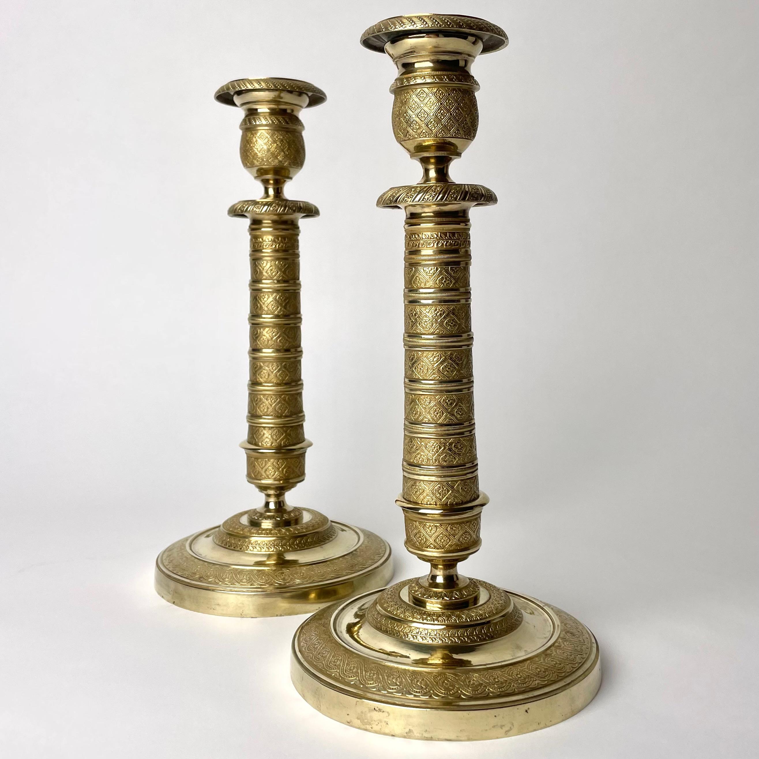 French Elegant pair of Empire Candlesticks in gilt bronze from the 1810s.  For Sale