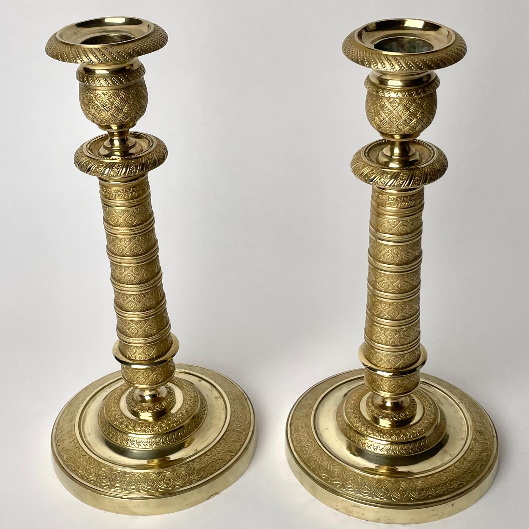 Gilt Elegant pair of Empire Candlesticks in gilt bronze from the 1810s.  For Sale