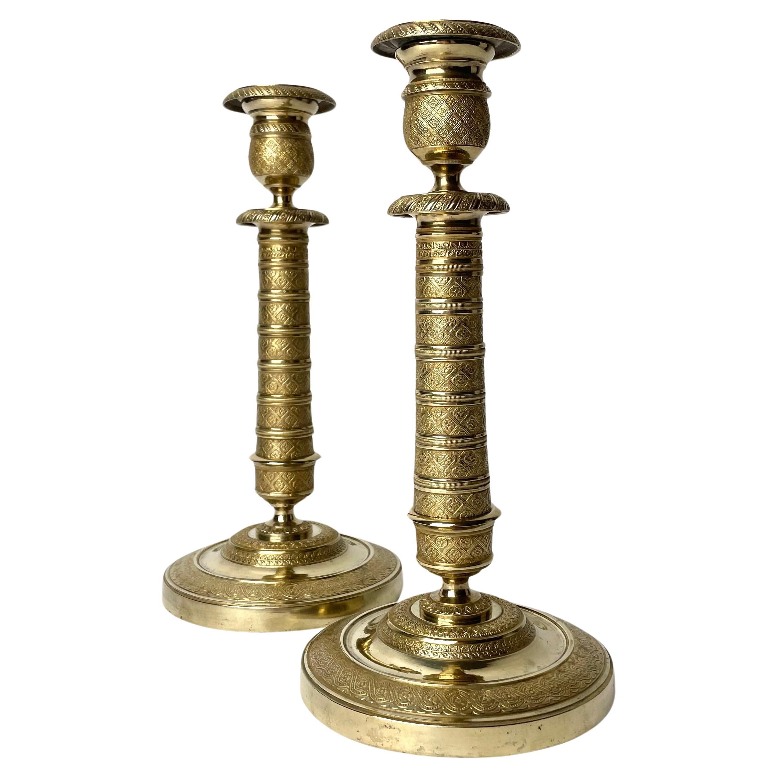 Elegant pair of Empire Candlesticks in gilt bronze from the 1810s.  For Sale
