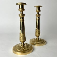 Elegant pair of Empire Candlesticks in gilt bronze from the 1820s