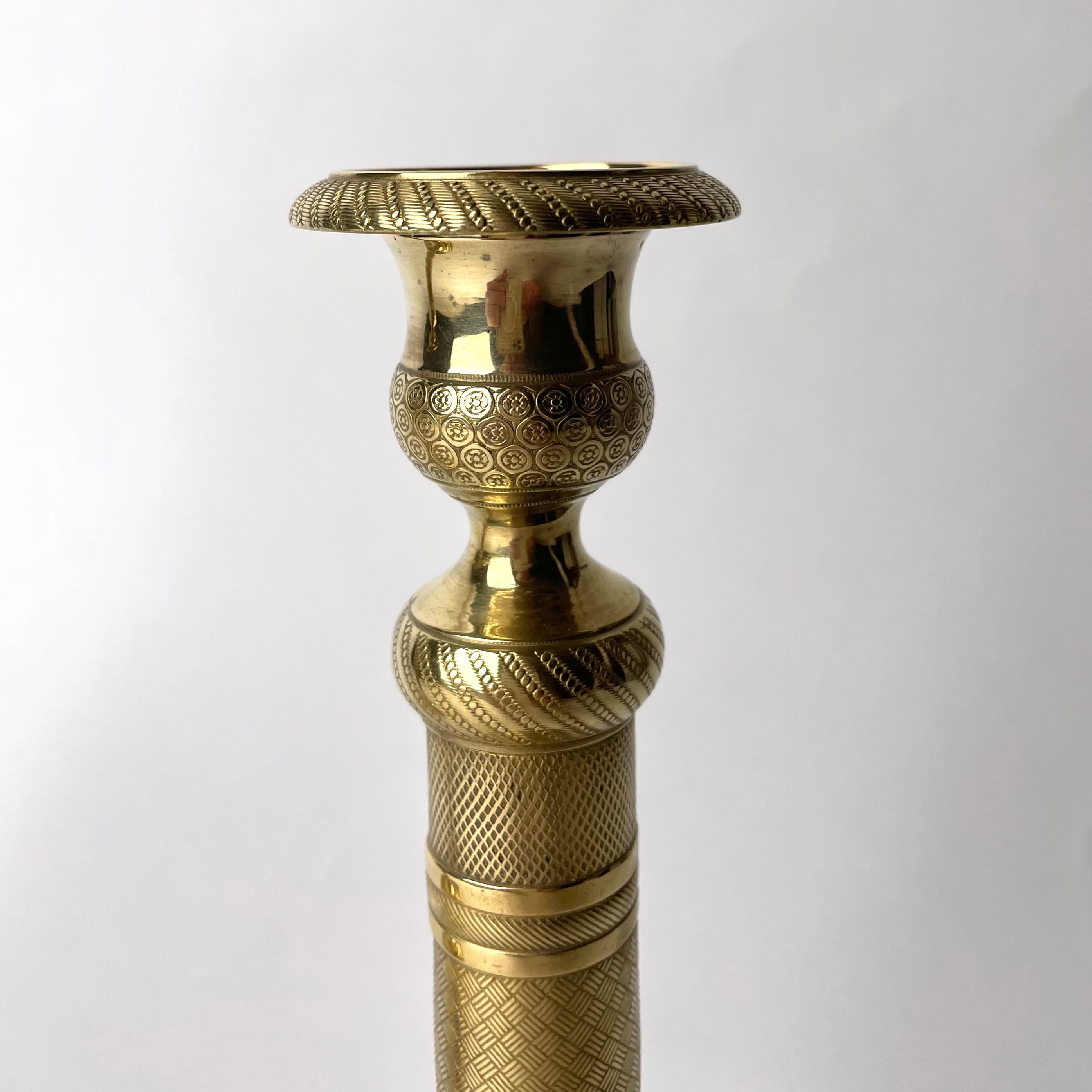 Bronze Elegant pair of Empire Candlesticks in gilt bronze from the 1820s For Sale
