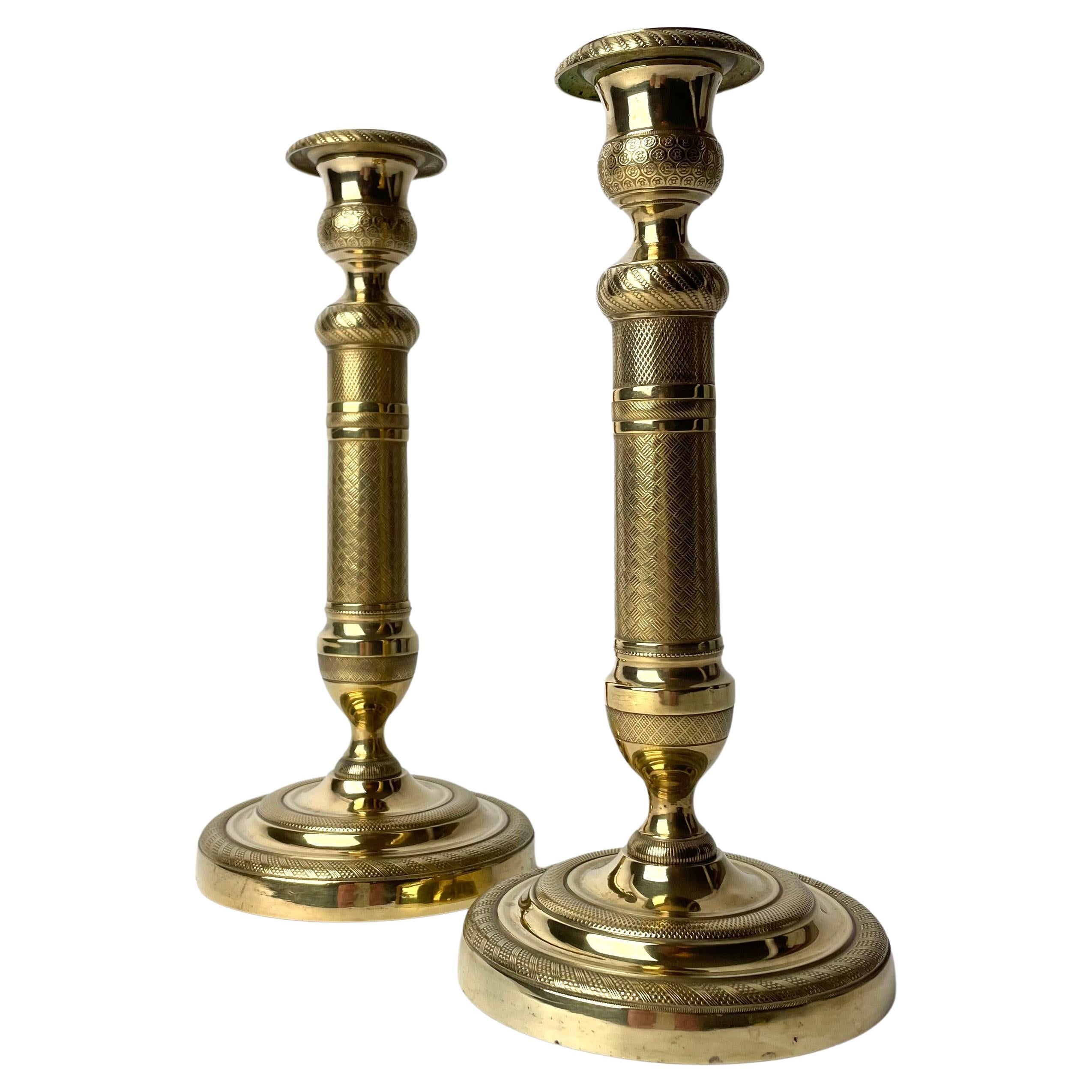 Elegant pair of Empire Candlesticks in gilt bronze from the 1820s For Sale