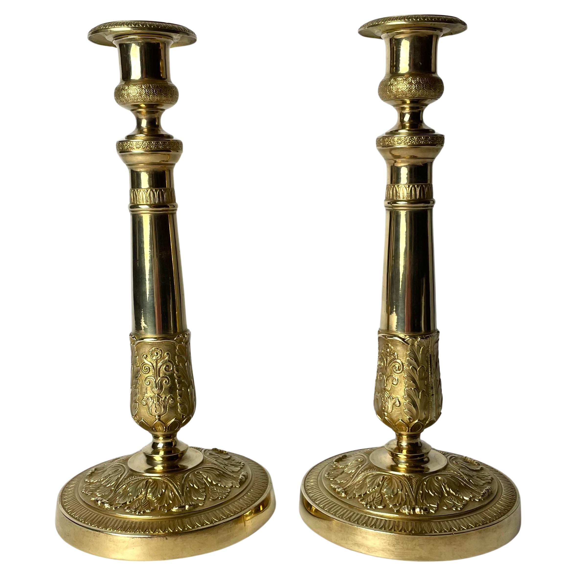 Elegant pair of Empire Candlesticks in gilt bronze from the 1820s For Sale