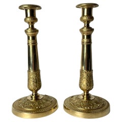 Antique Elegant pair of Empire Candlesticks in gilt bronze from the 1820s