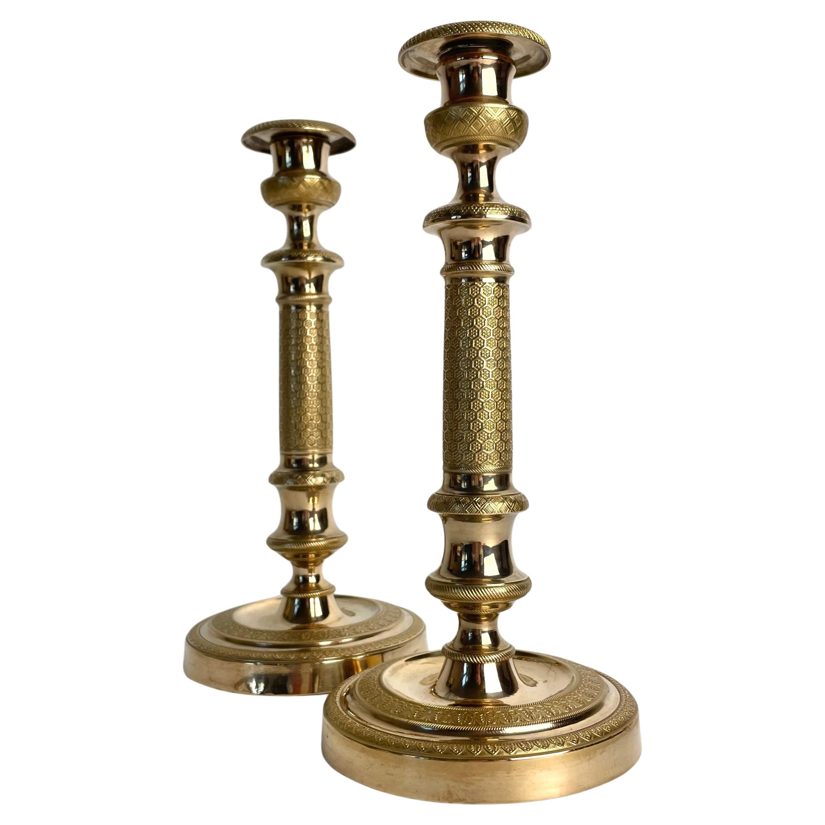 Elegant pair of Empire Candlesticks in gilt bronze from the 1820s. 